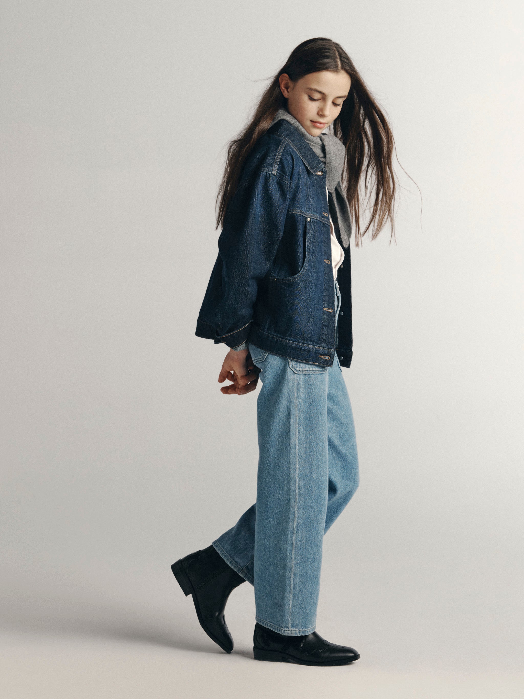 DL1961 Kids girls' Lily wide-leg jeans in Sky Fade with a denim jacket, full-length side profile in a studio.