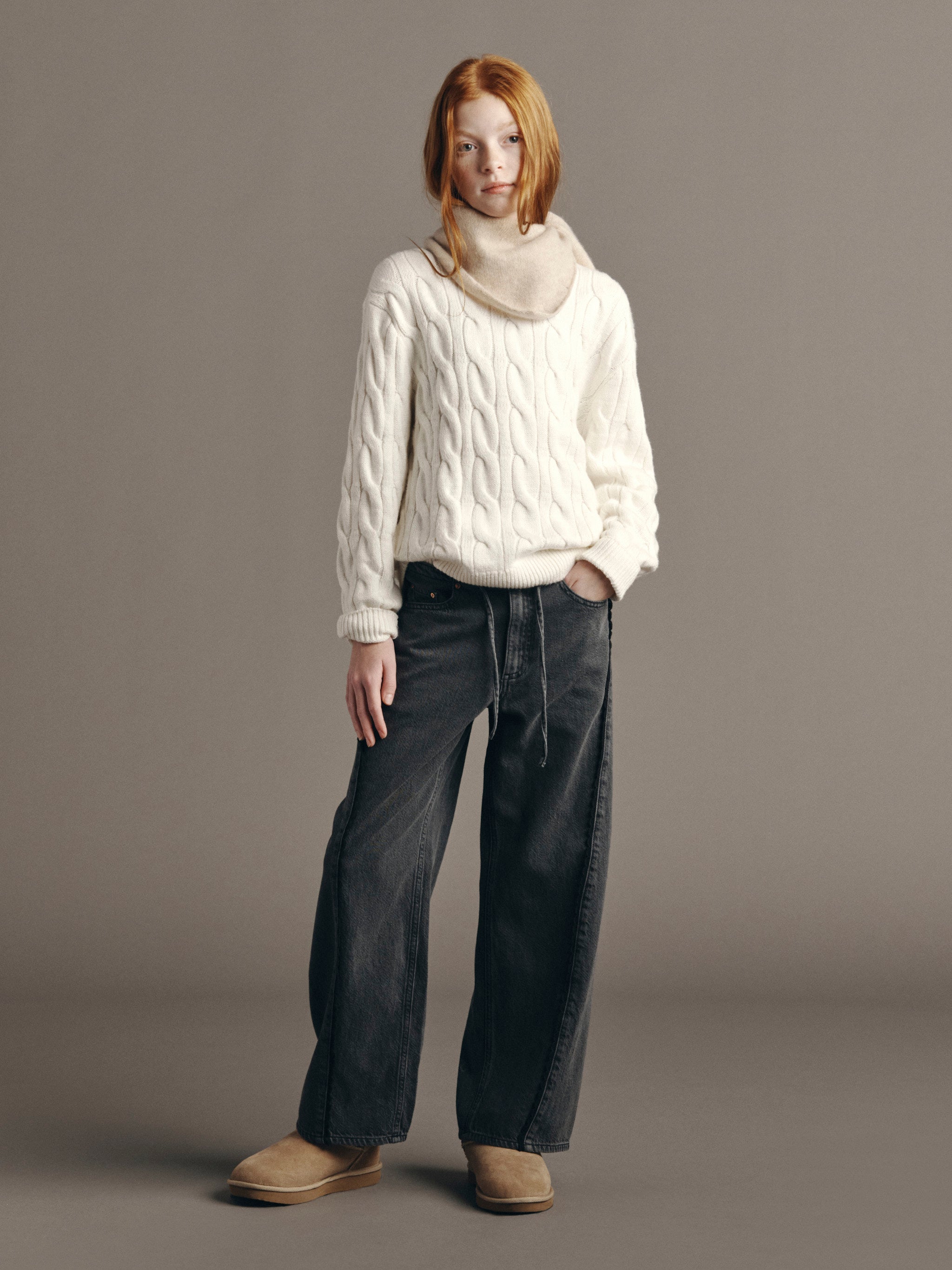 DL1961 Kids girls' Frankie low-slung jeans in Nightshade Lace with a cream cable-knit sweater, full-length front, studio.