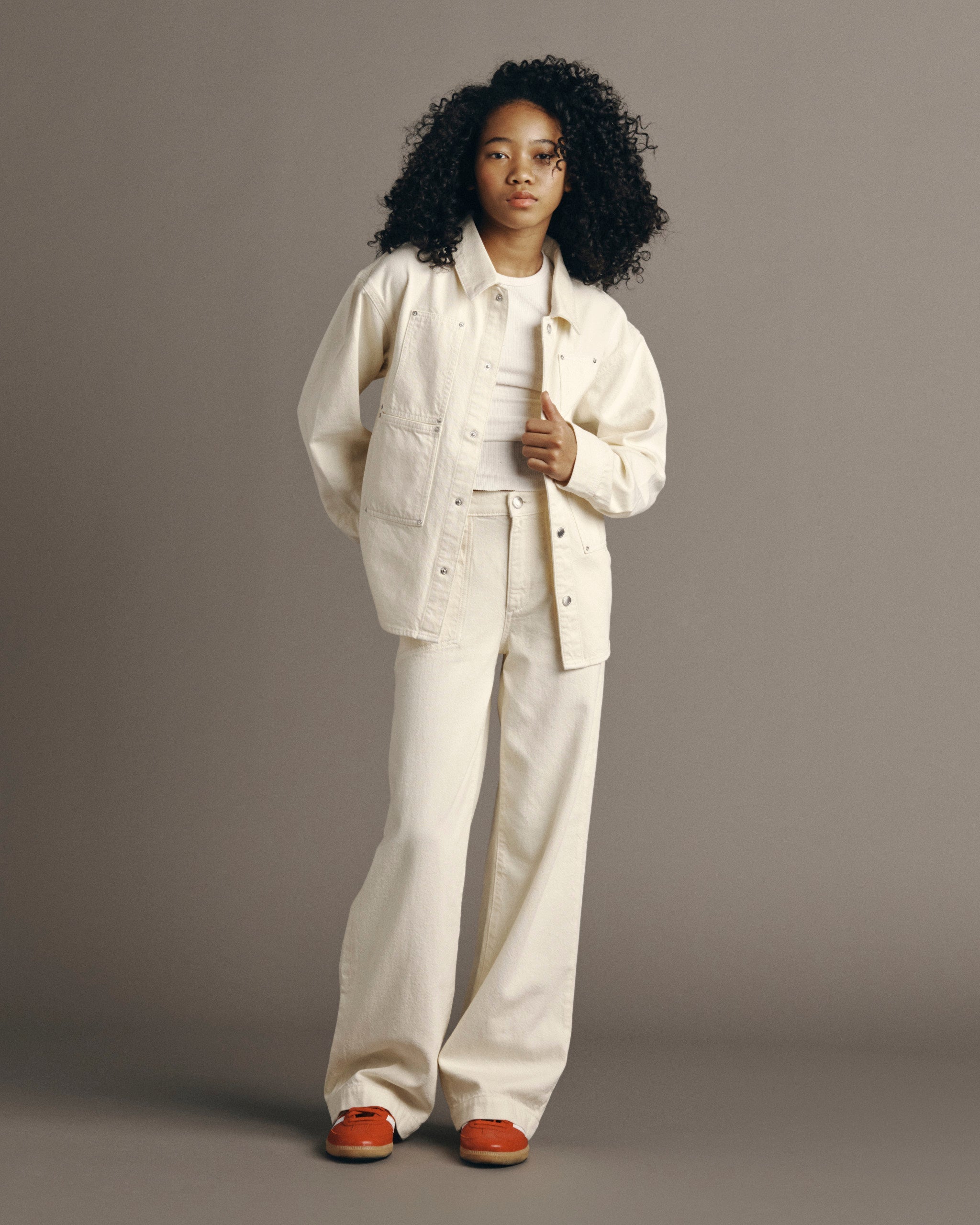 DL1961 Kids girls' Lily wide-leg jeans in Sugar Cookie with a matching Olivia shirt, full-length front view in a studio.