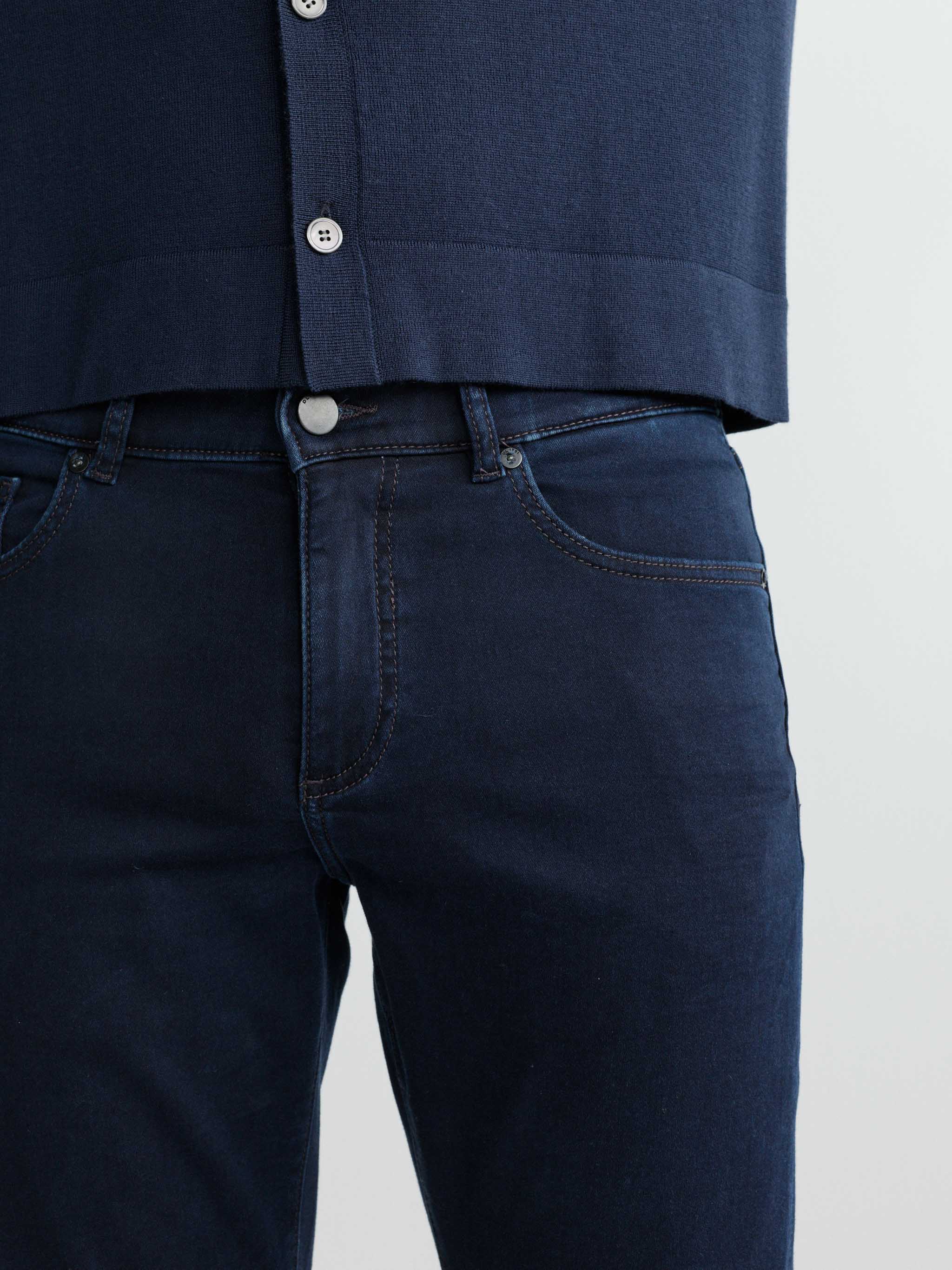Navy blue shirt and jeans on a white background