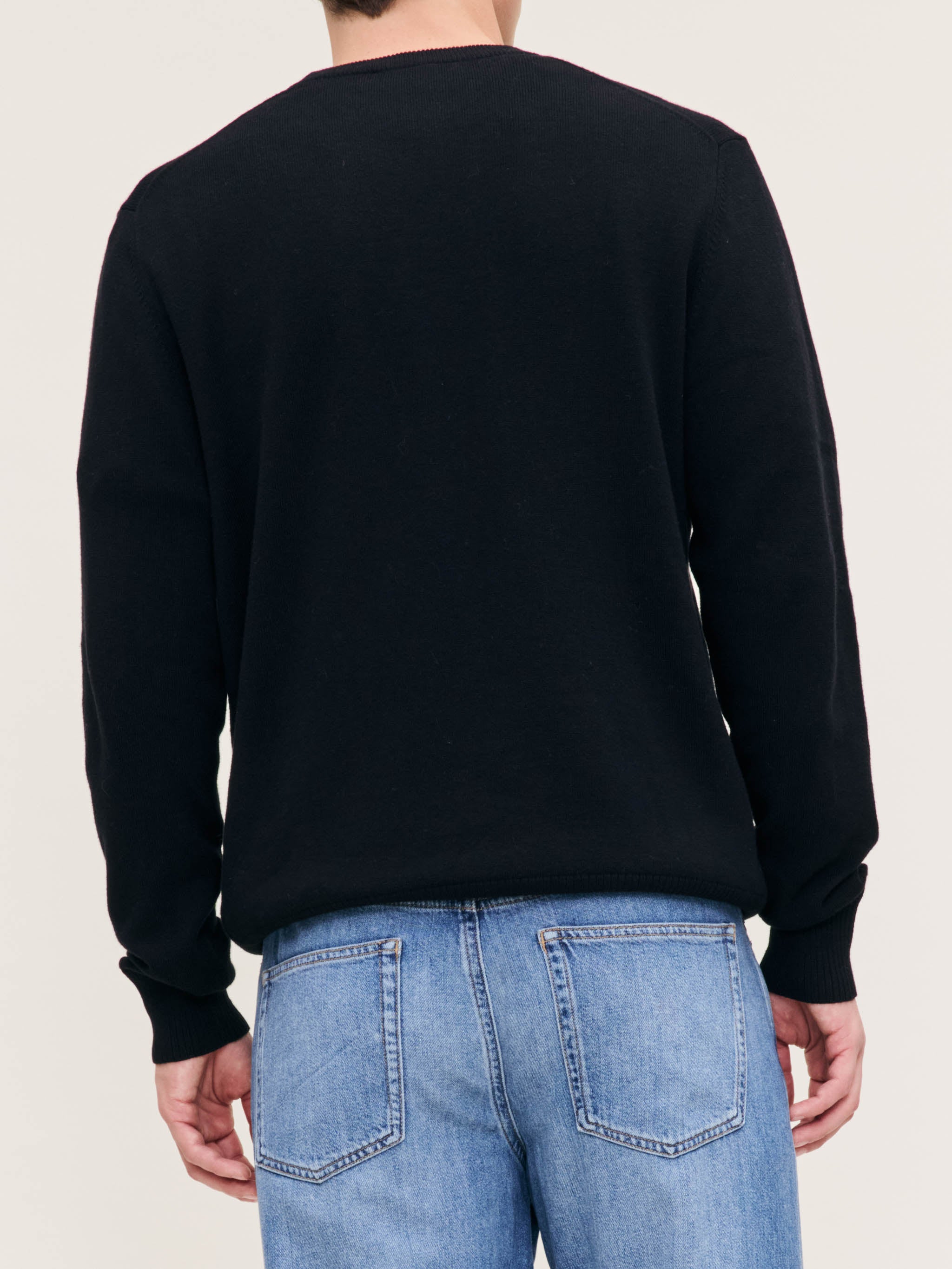 DL1961 men's Classic Crewneck sweater in black, back close-up of ribbed knit on model.