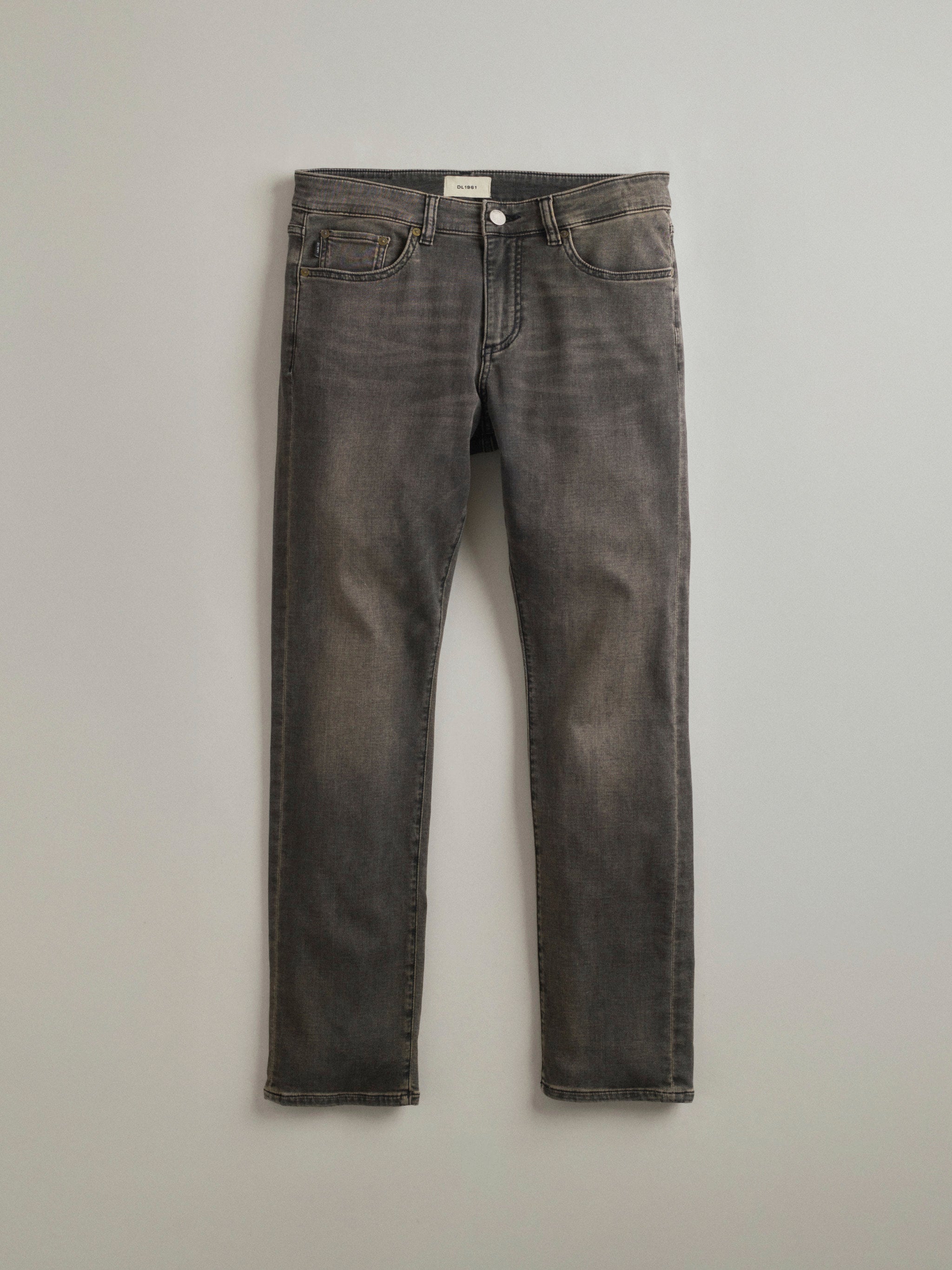 DL1961 men's Russell Slim Straight Jeans in 'Rock' — studio flat lay packshot on a plain background, no model.