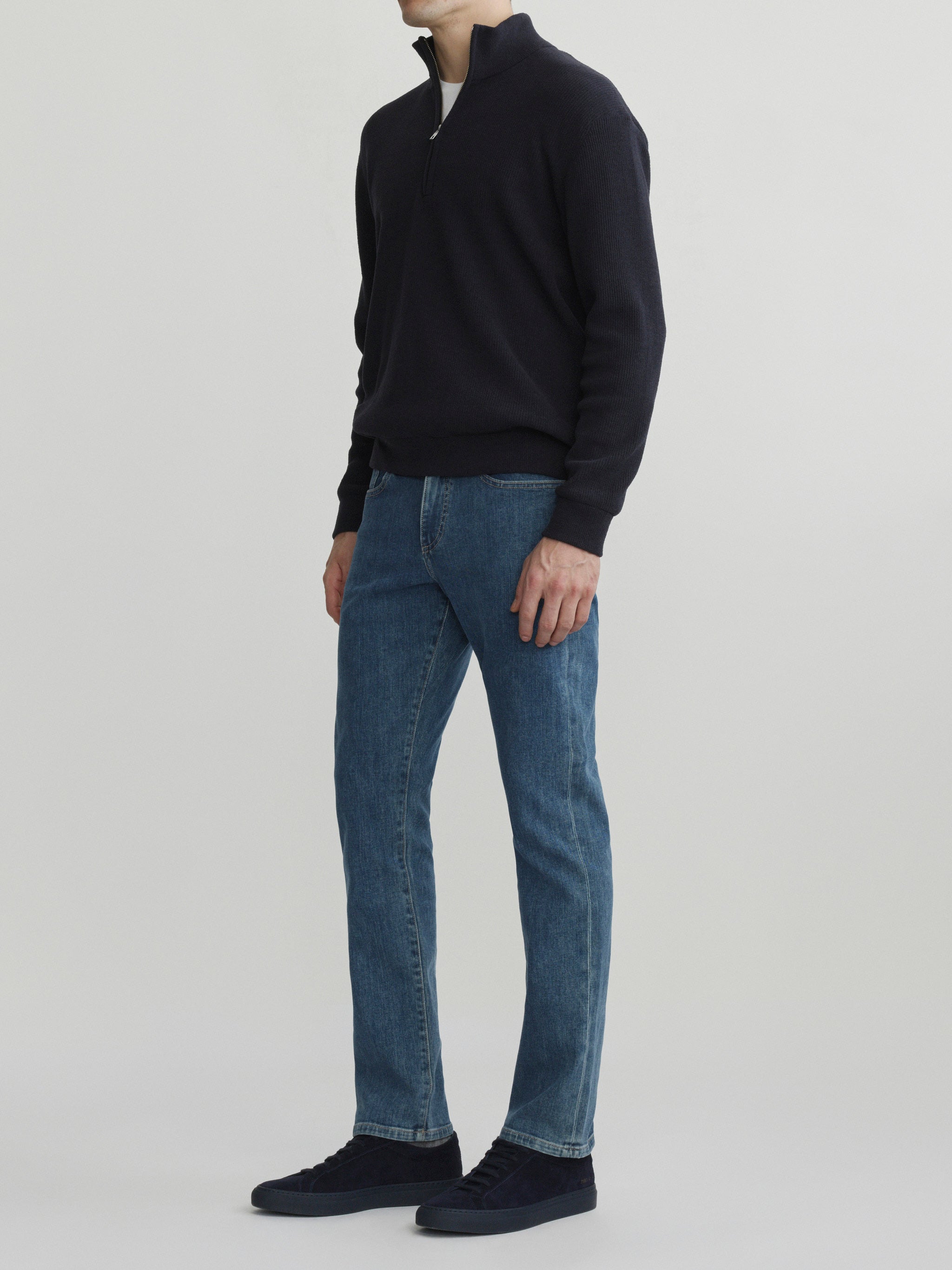 DL1961 men's Russell Slim Straight jeans in medium blue 'Highland Park', three-quarter front view showing the straight leg.