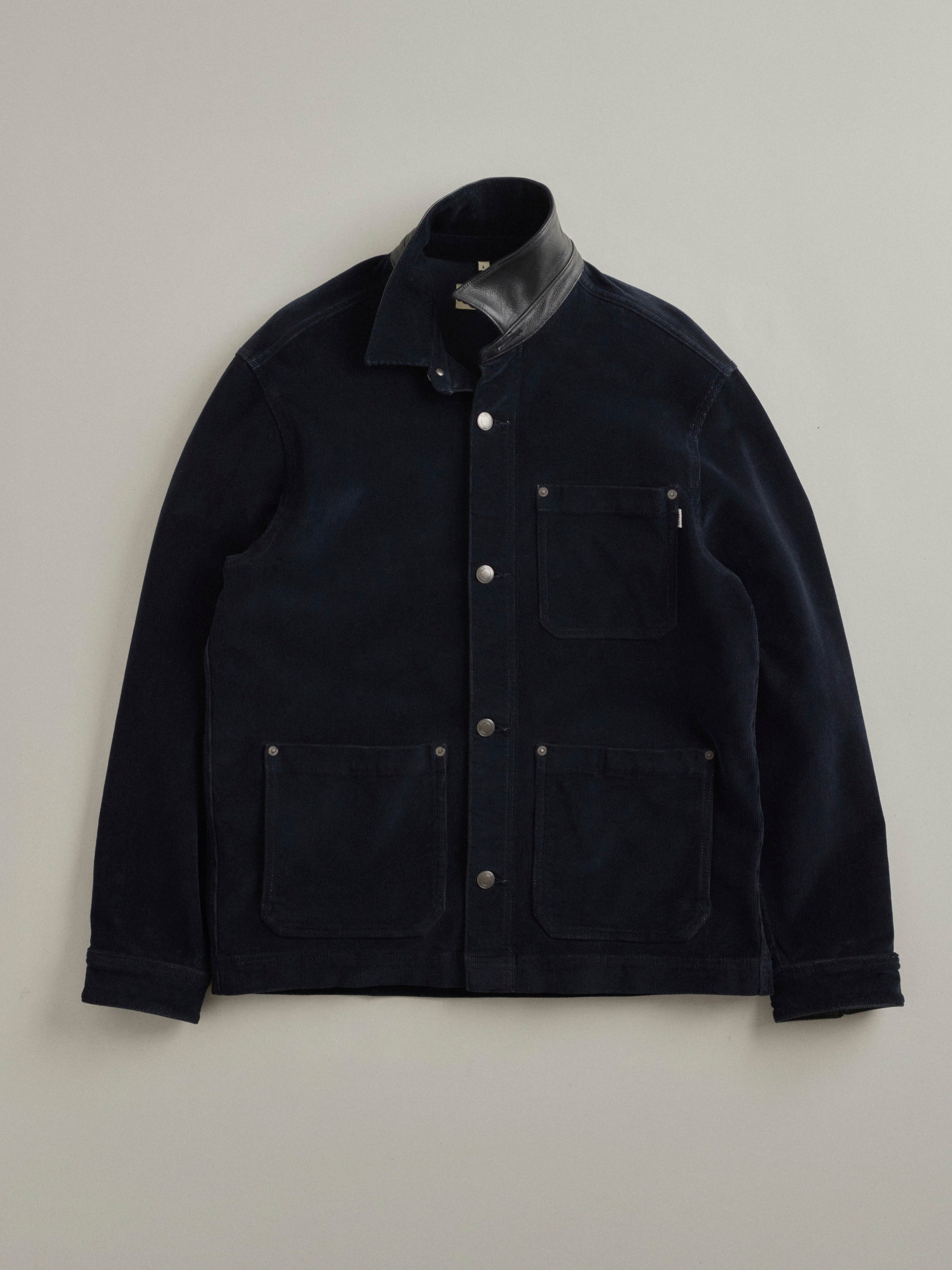 DL1961 men's Sean corduroy shirt jacket in navy 'Skyline', flat lay front view with the leather stand collar turned up.