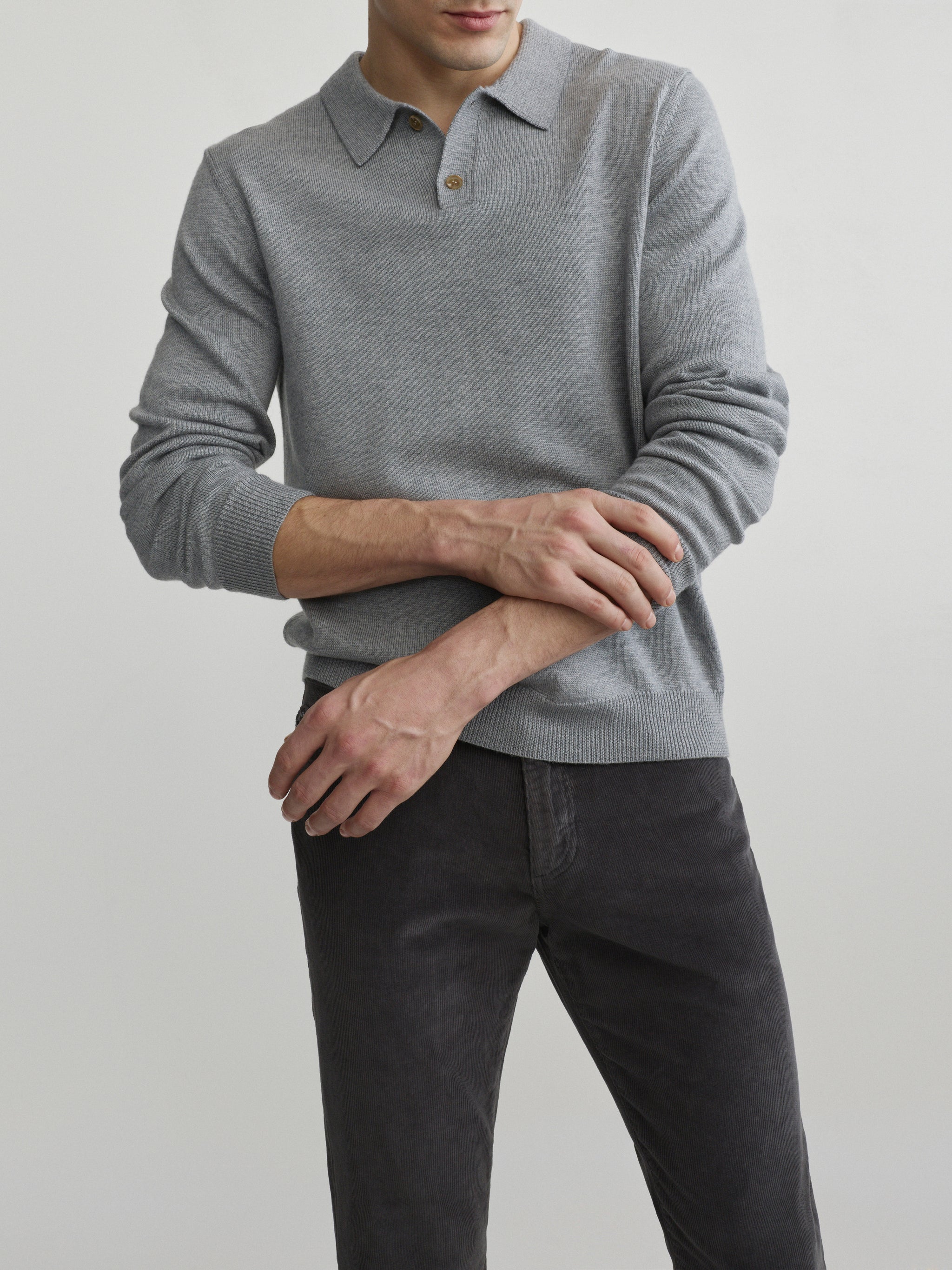 DL1961 men's long-sleeve knit polo in grey melange, front view with two-button collar and charcoal cords