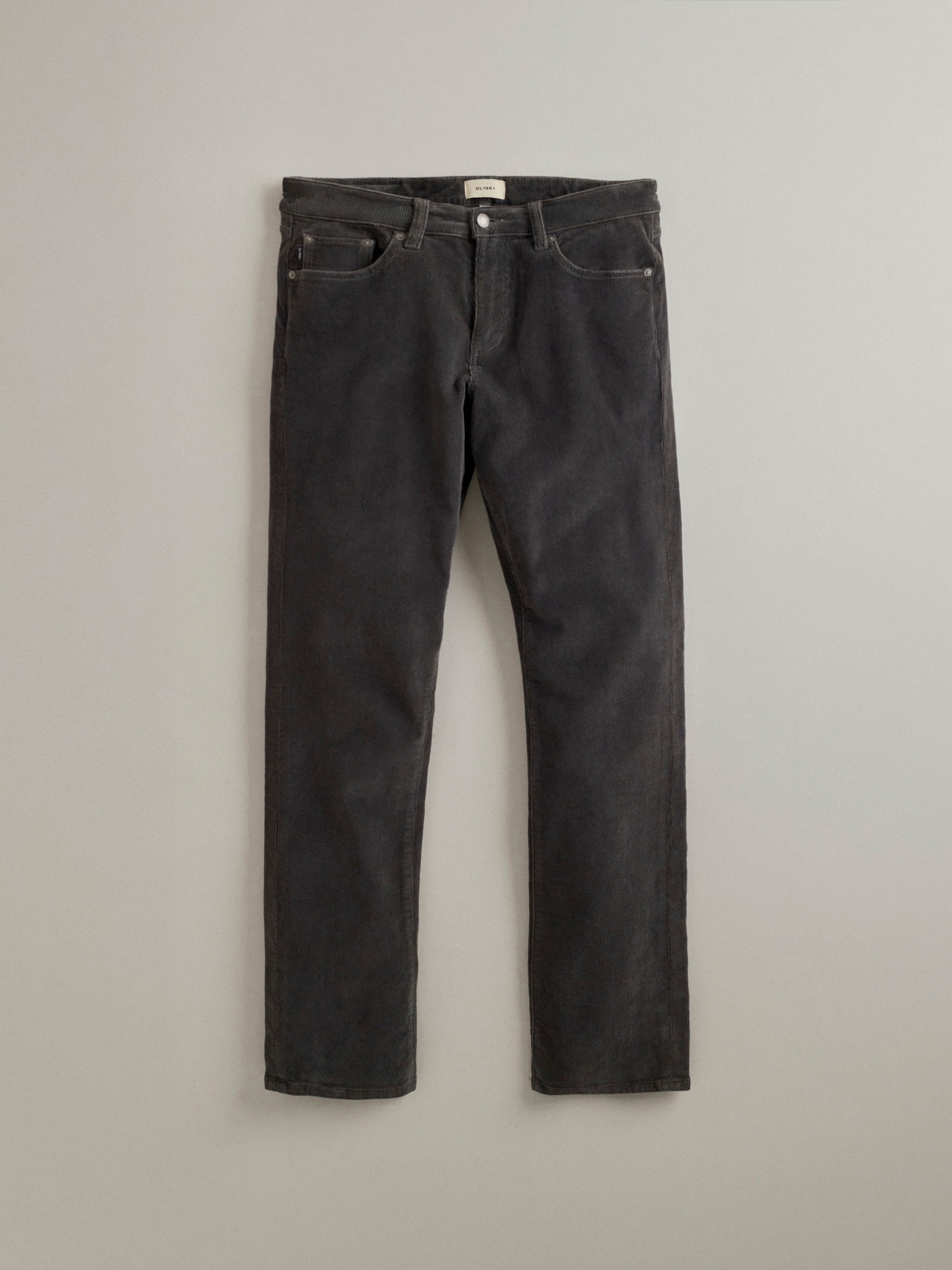 DL1961 men's Russell Slim Straight corduroy pants in dark grey 'Graphite', flat lay front view showing the fine wale.