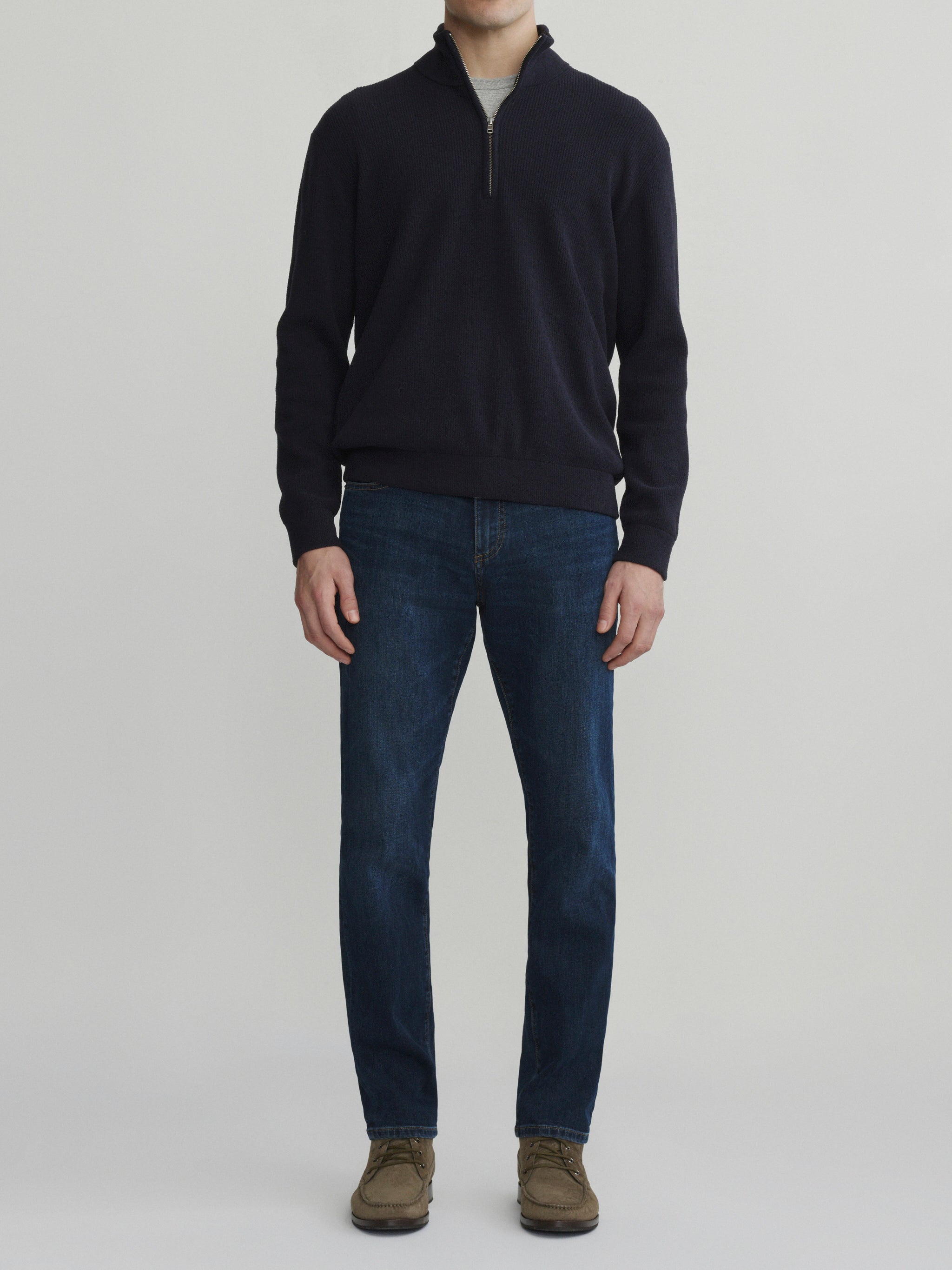 DL1961 men's Nick slim jeans in dark indigo 'Reader', front view styled with a navy quarter-zip sweater