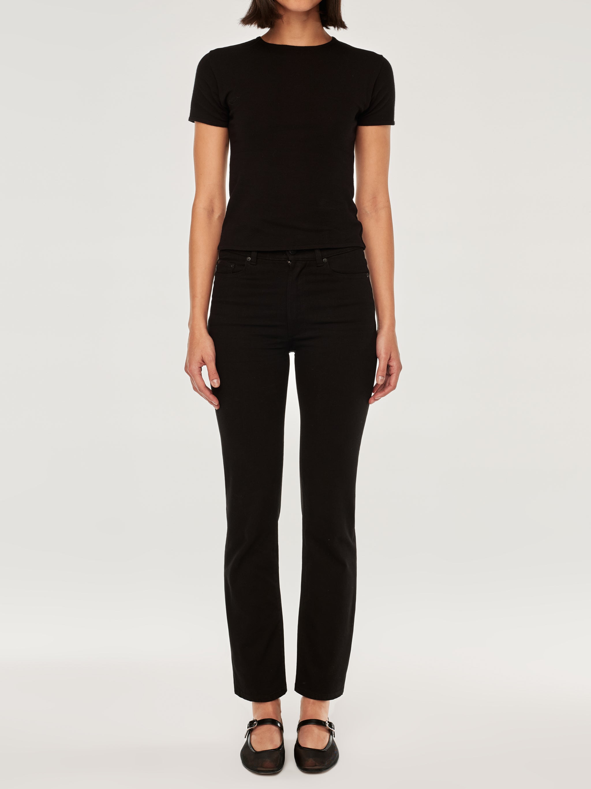 Halle jeans in Black Peach, close-up of the high-rise waist and back pocket on a model.