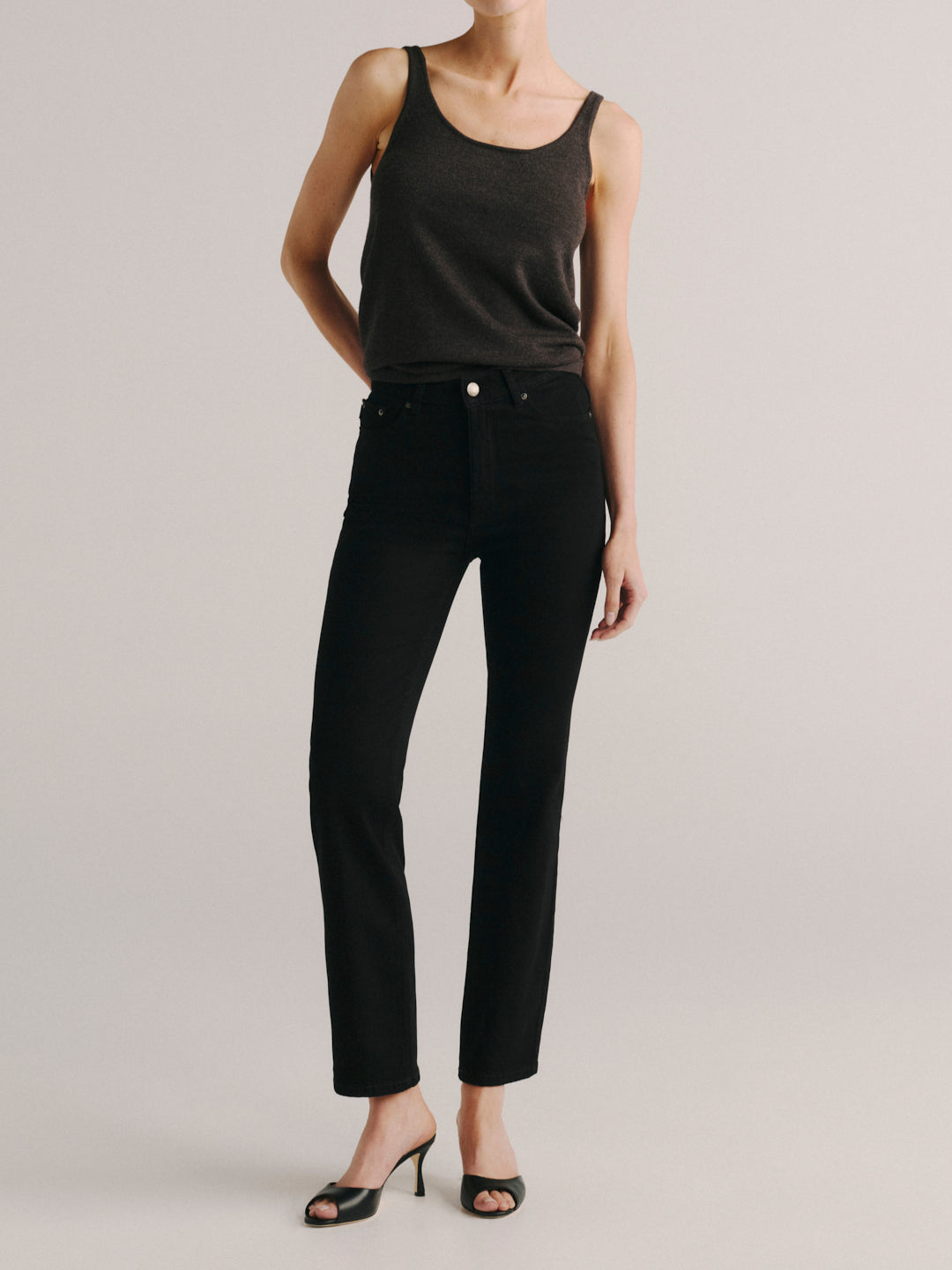 DL1961 Halle Straight high-rise jeans in black 'Black Peach' wash, with a brown knit tank, front view.
