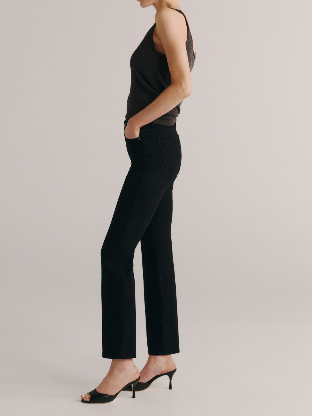 DL1961 Halle Straight high-rise jeans in black 'Black Peach' wash, side profile showing the straight leg.