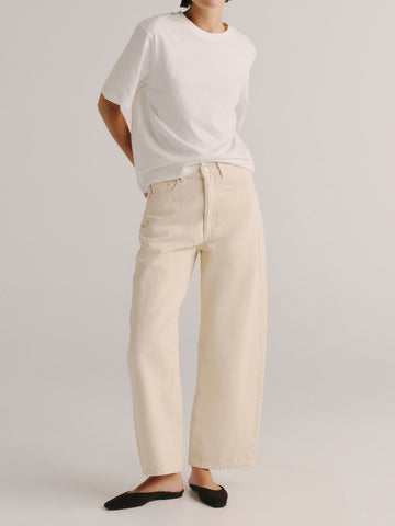 DL1961 women's Taylor Barrel Ultra High-Rise jeans in cream ecru 'Flax', front view on model with white tee.