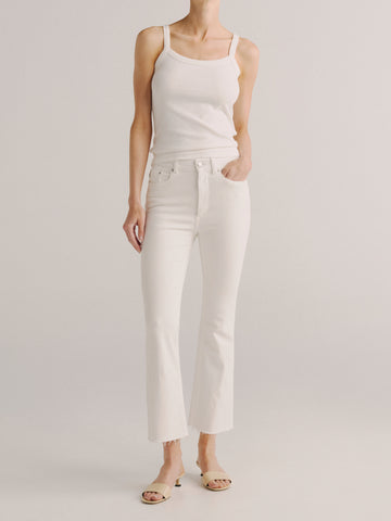 DL1961 women's Bridget Boot High-Rise Crop jeans in white 'White', front view on model with tank top.