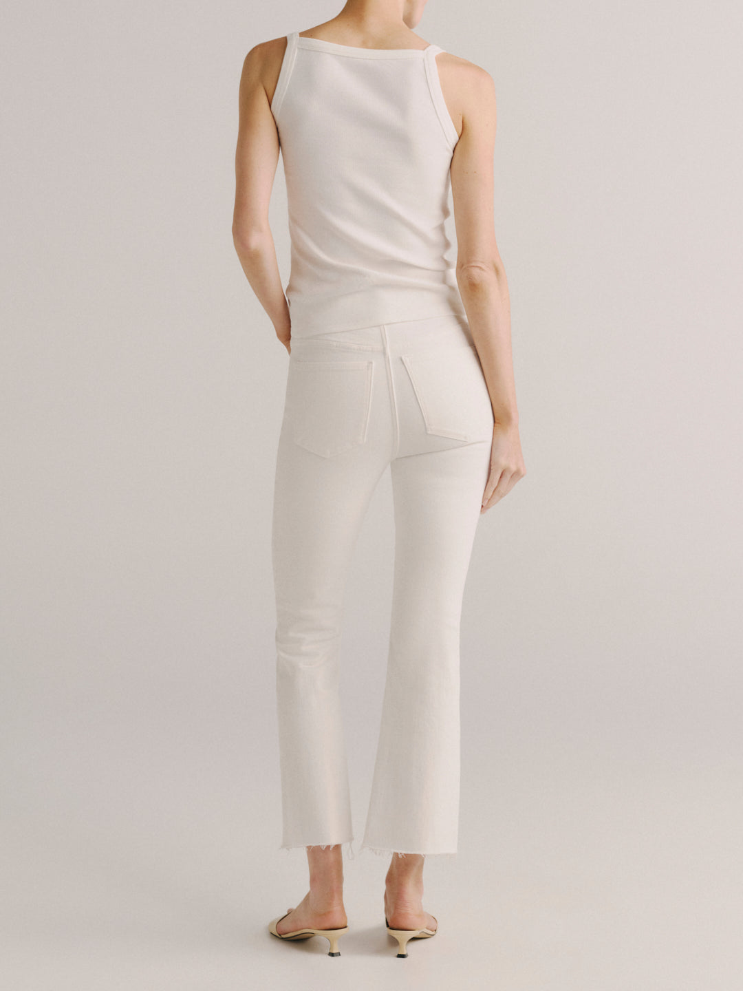 DL1961 women's Bridget Boot High-Rise Crop jeans in white 'White', back view on model.