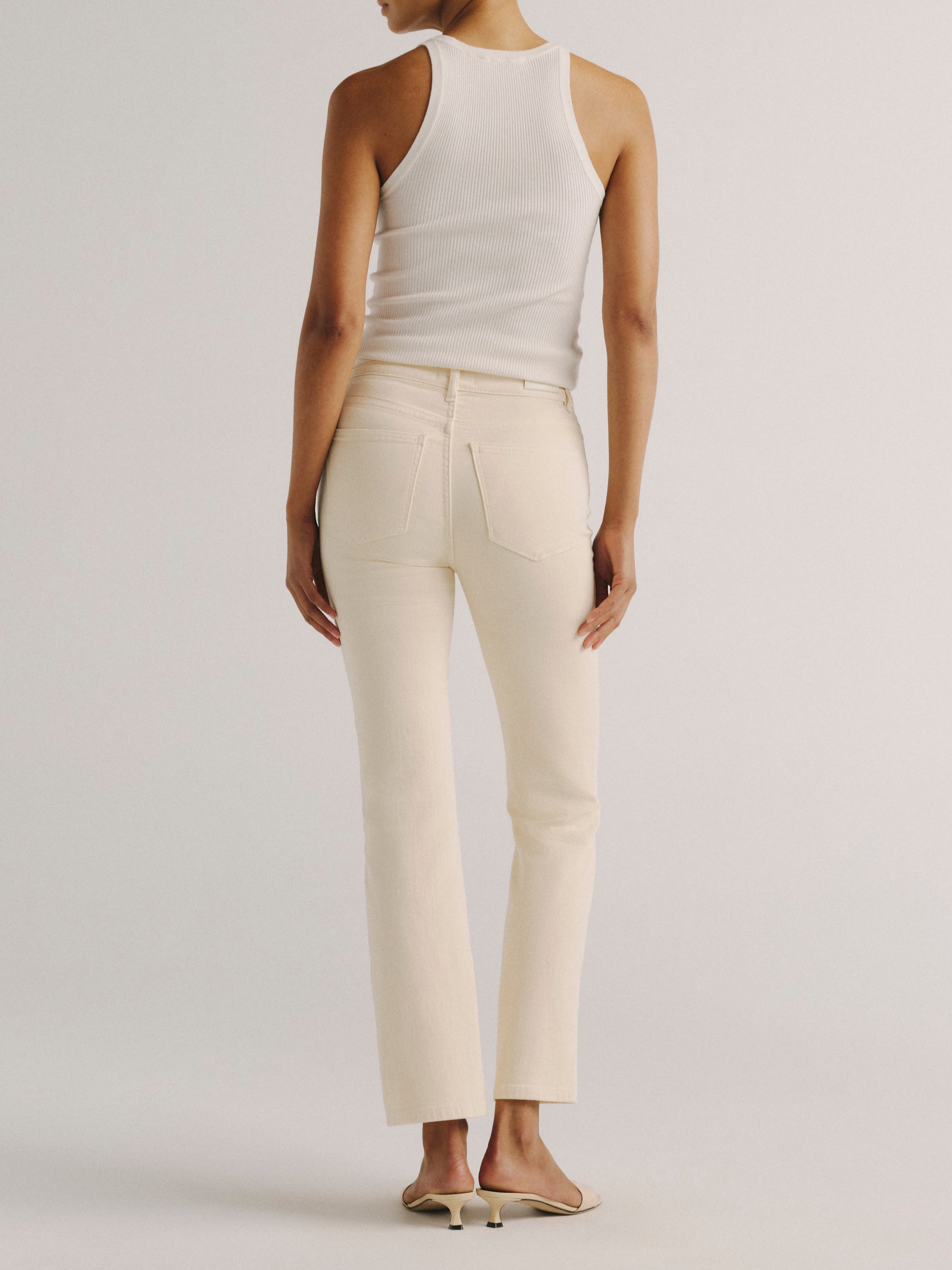 DL1961 women's Halle Straight High Rise Instasculpt jeans in 'Ecru', back view showing the rear pockets and straight leg.