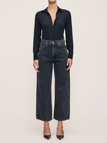 DL1961 Taylor Relaxed Barrel ultra-high-rise cropped jeans in washed-black 'Nightshade', black blouse, front view.