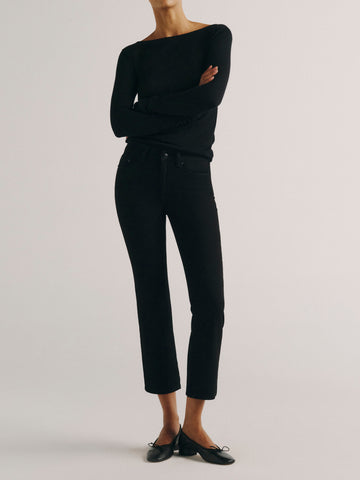 DL1961 women's Mara Straight Mid Rise Instasculpt ankle jeans in black, front view styled with a black top and ballet flats.