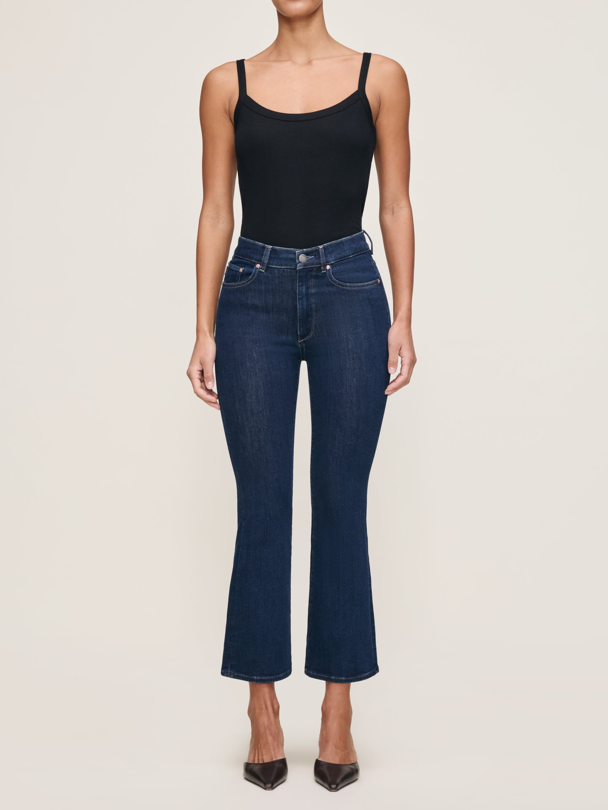 Bridget jeans in Lunar Sky styled with the Ribbed Tank in Black, full-length front view in a studio.
