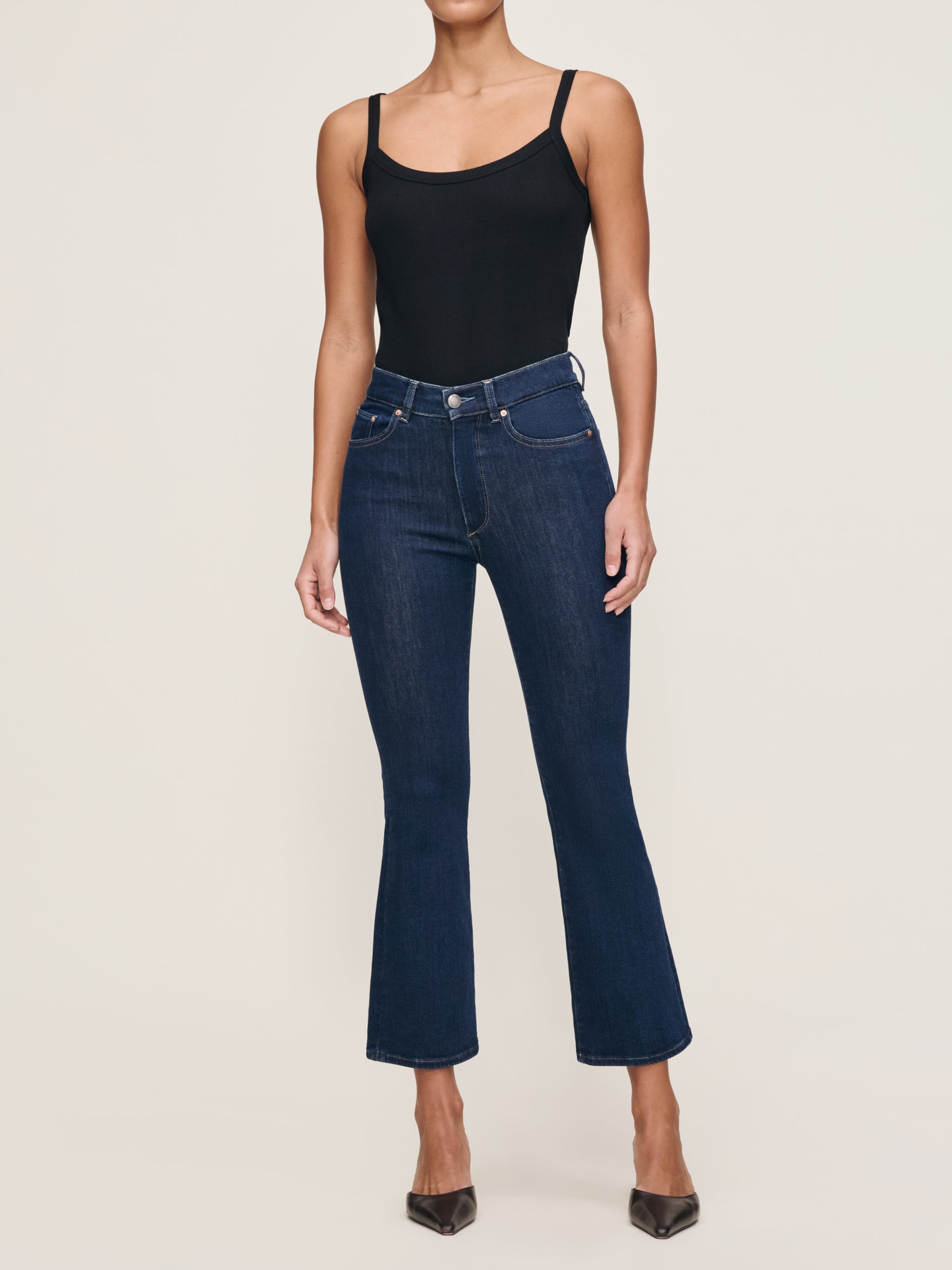 Bridget jeans in Lunar Sky with the Ribbed Tank in Black, full-length front view in a studio.