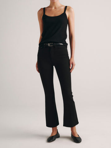 DL1961 Bridget Boot high-rise cropped bootcut jeans in dark 'Hail' wash, with a black tank, front view.
