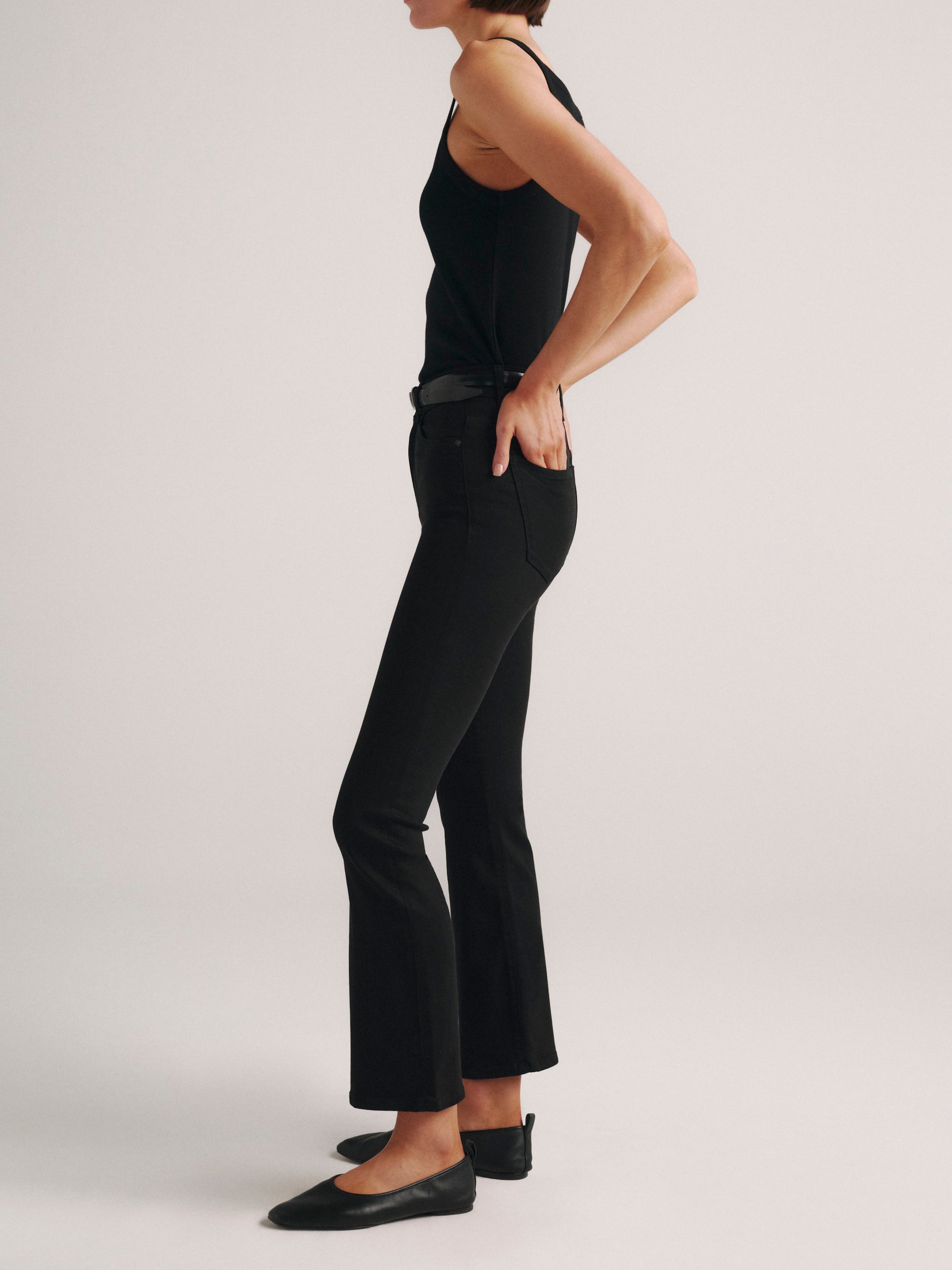 DL1961 Bridget Boot high-rise cropped bootcut jeans in dark 'Hail' wash, side profile showing the cropped flare.