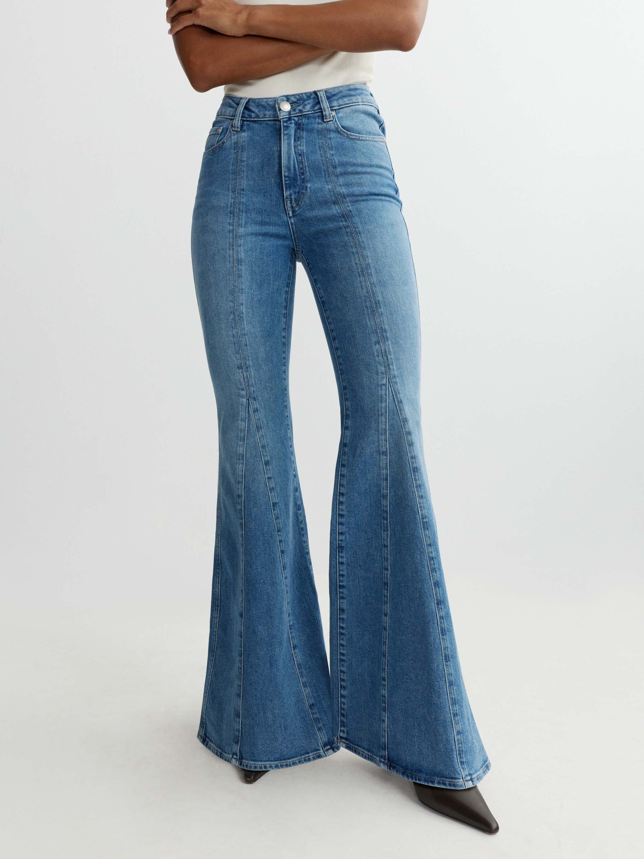 Blue flared jeans on a white background