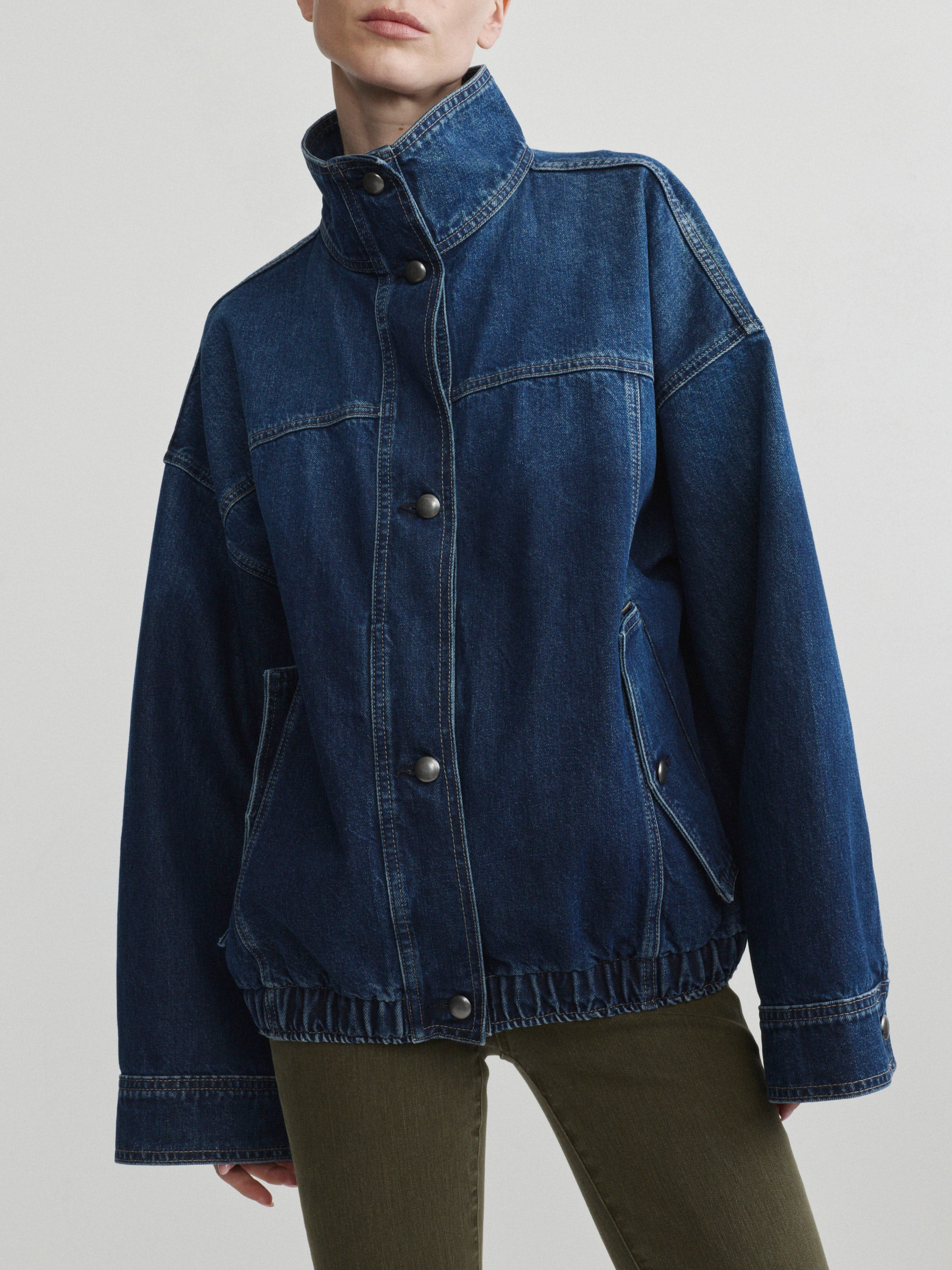 Bridget Boot jeans in Pine with the Nara Jacket in December denim on a model, front view in studio.