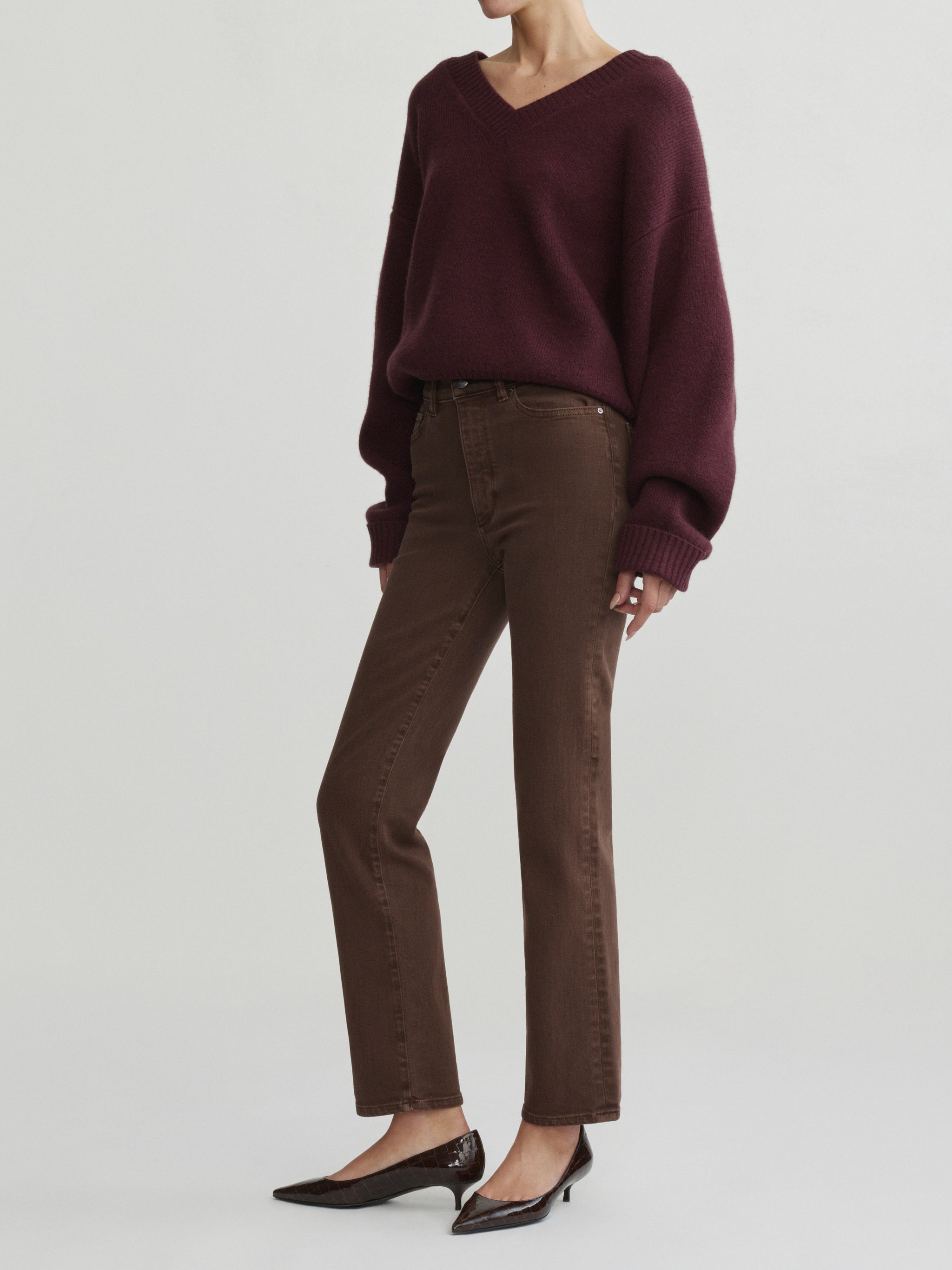 Halle Straight jeans in Brownstone with Robbie Sweater in Cacao on a model, full-length three-quarter view.