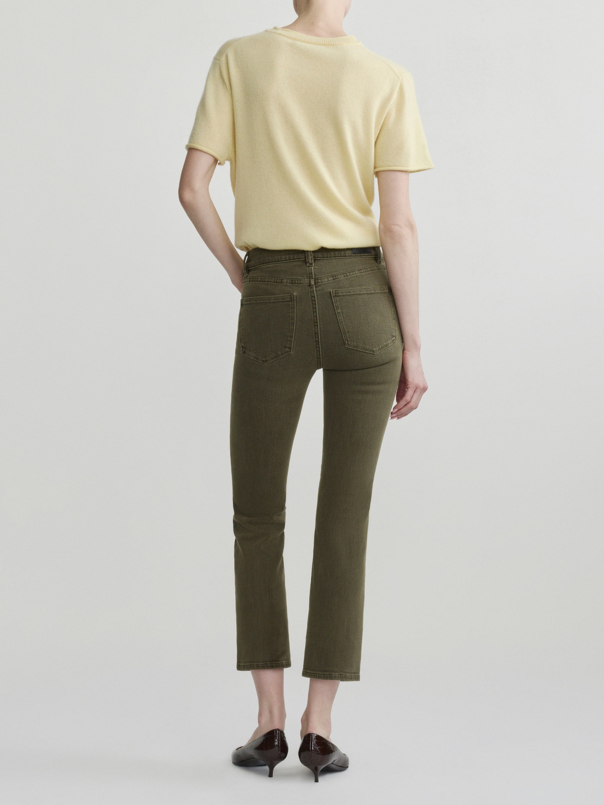 Mara Straight jeans in Pine with Knit Tee in Moonlight on a model, full-length back view in studio.