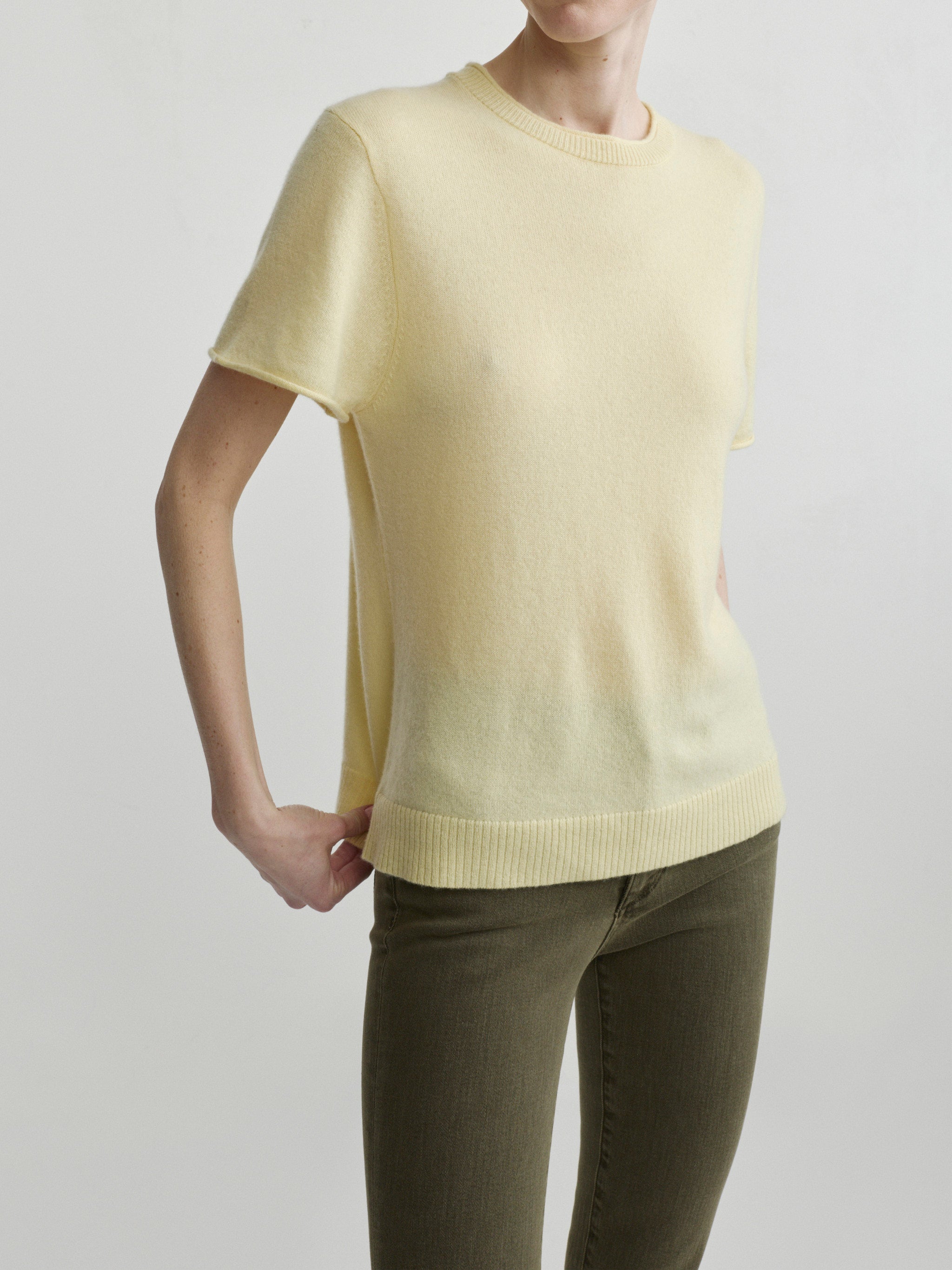 Mara Straight jeans in Pine with Knit Tee in Moonlight on a model, three-quarter portrait view in studio.