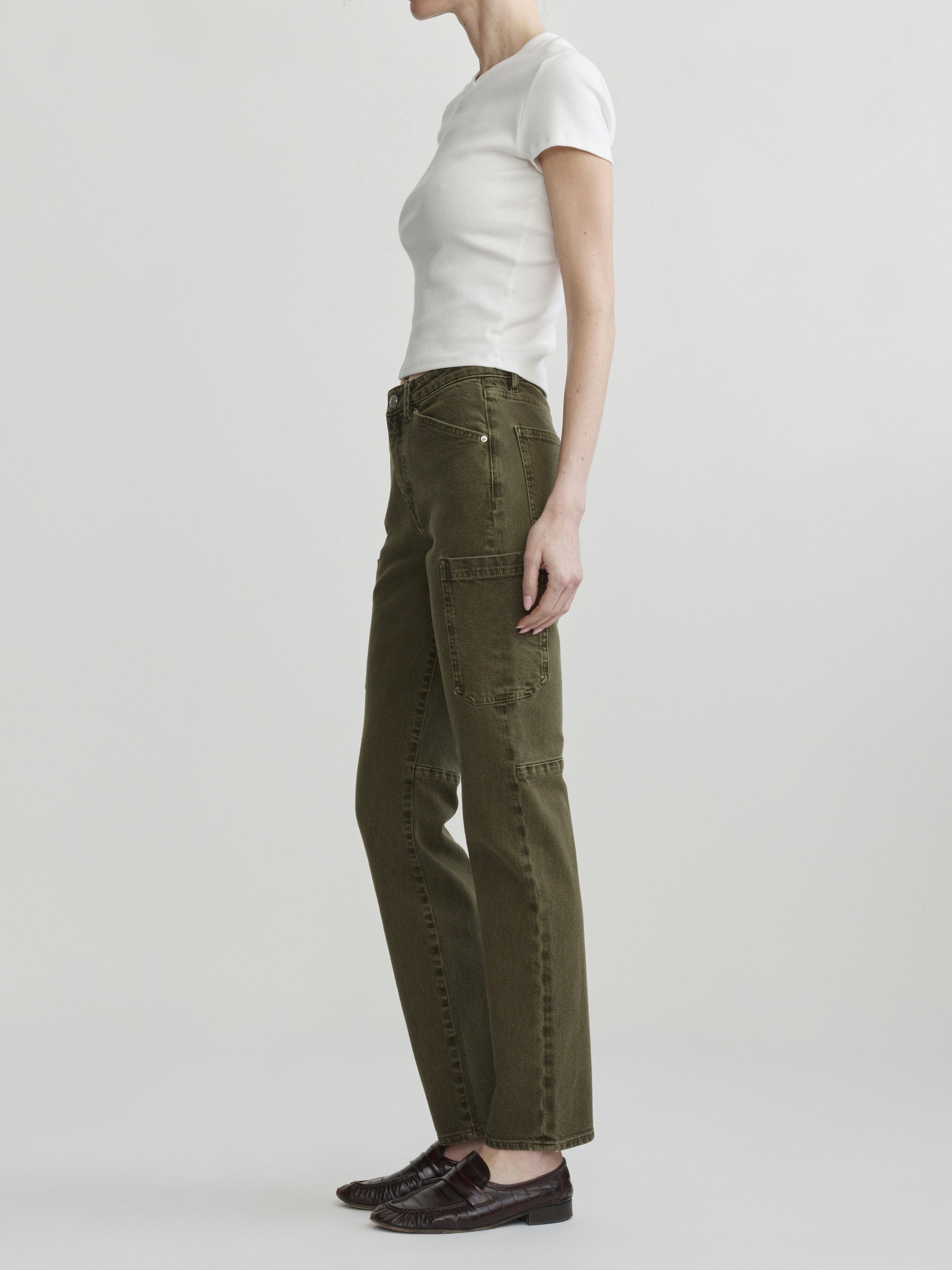 Devon Cigarette jeans in Pine with white tee on a model, full-length side view in studio.