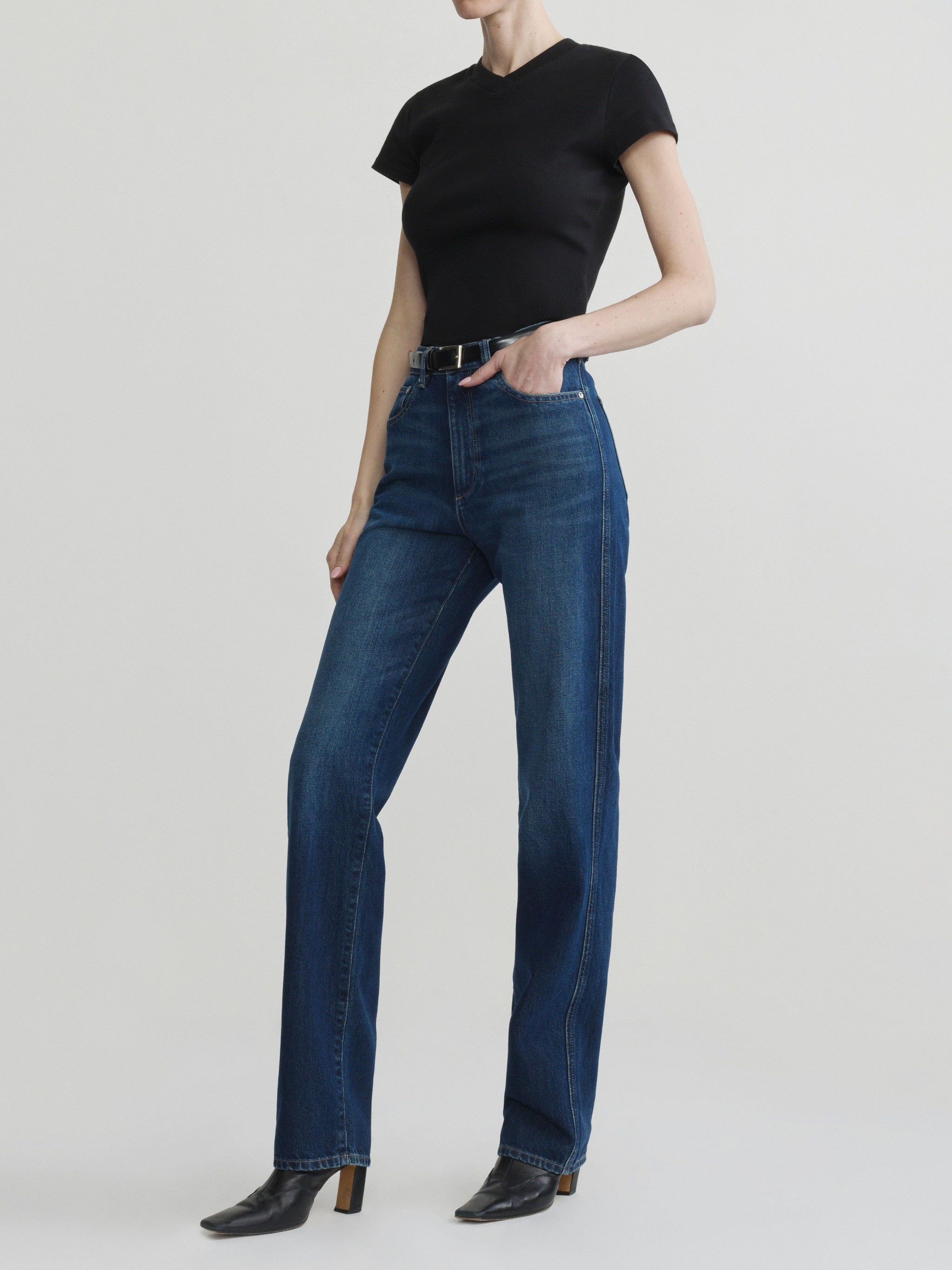 Cate Slim jeans in December with black tee on a model, full-length three-quarter view in studio.