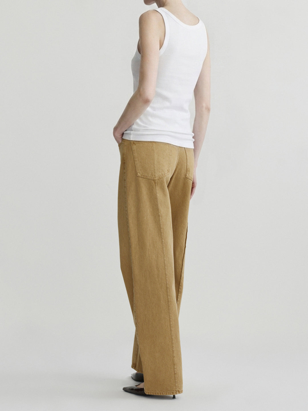 Kaylen Soft Curve jeans in Savannas with a white tank top, three-quarter back view on model.