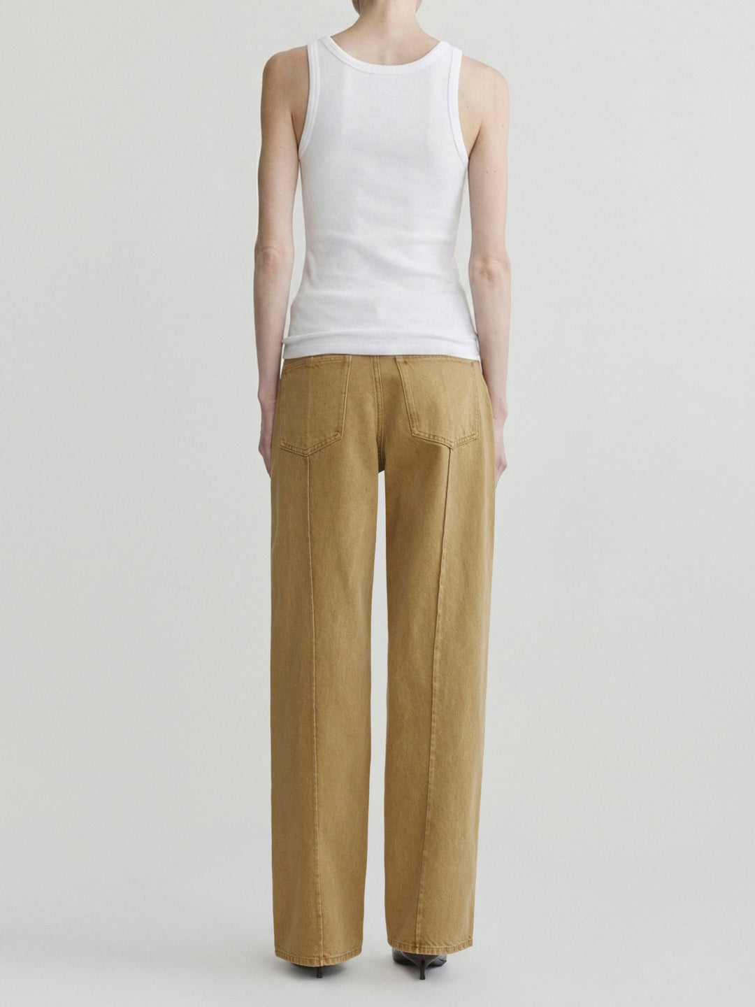 Kaylen Soft Curve jeans in Savannas with the Amalie Top in a white tank top, full-length back view on model.