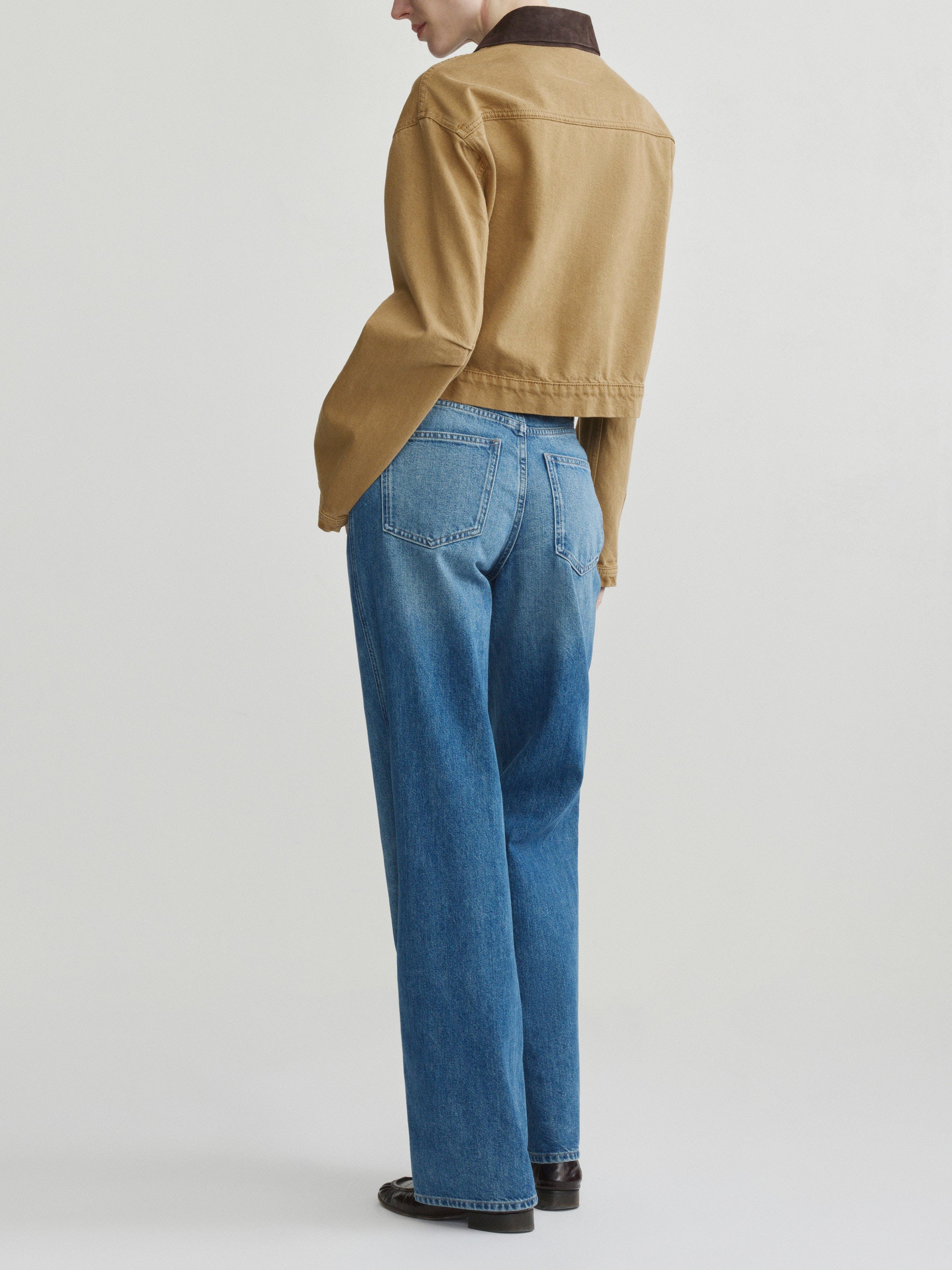 Kaylen Soft Curve jeans in Authentic with the Boxy Denim Jacket in Savannas, full-length back view on model.