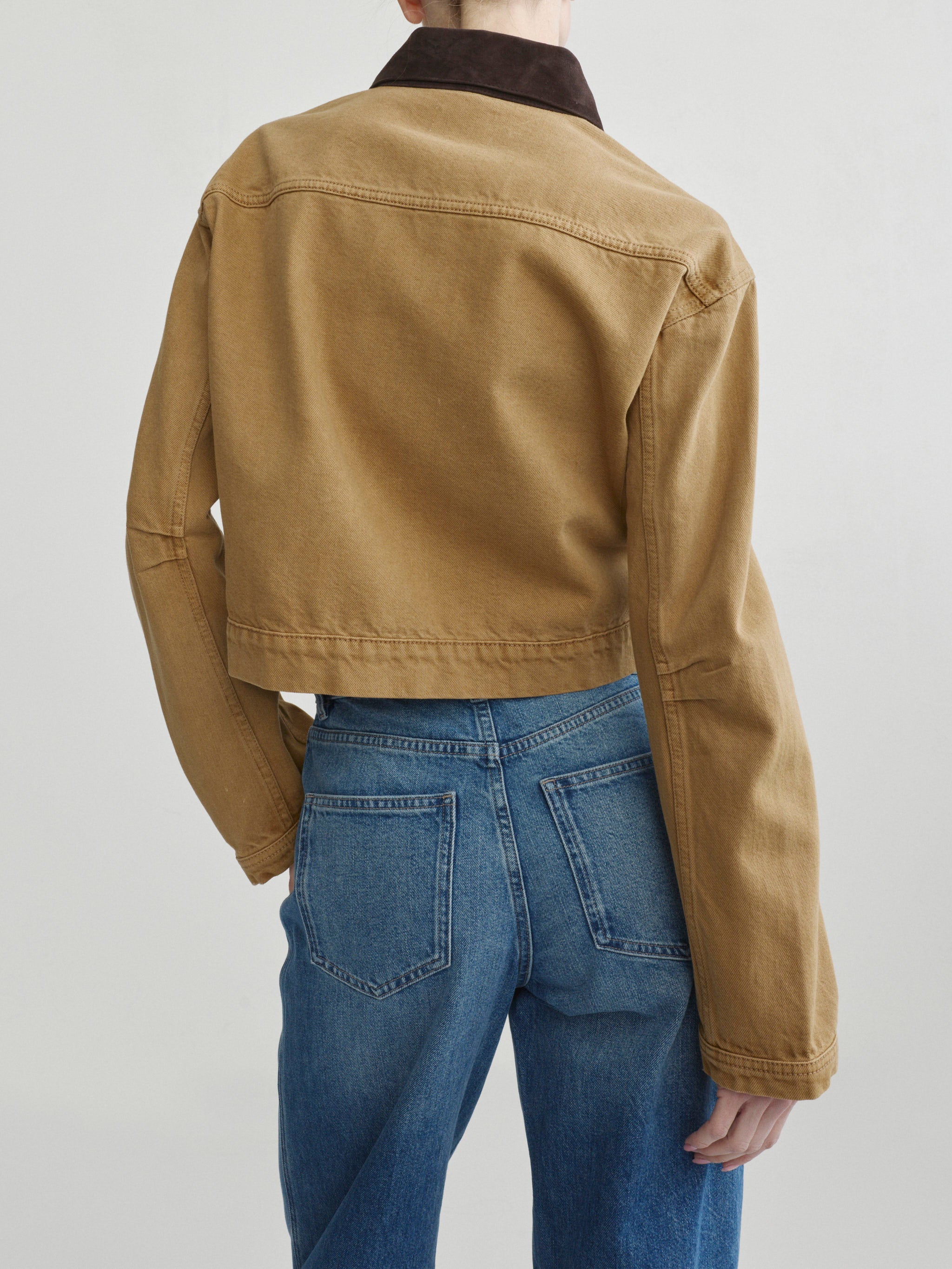 Kaylen Soft Curve jeans in Authentic with the Boxy Denim Jacket in Savannas, back view close-up on model.