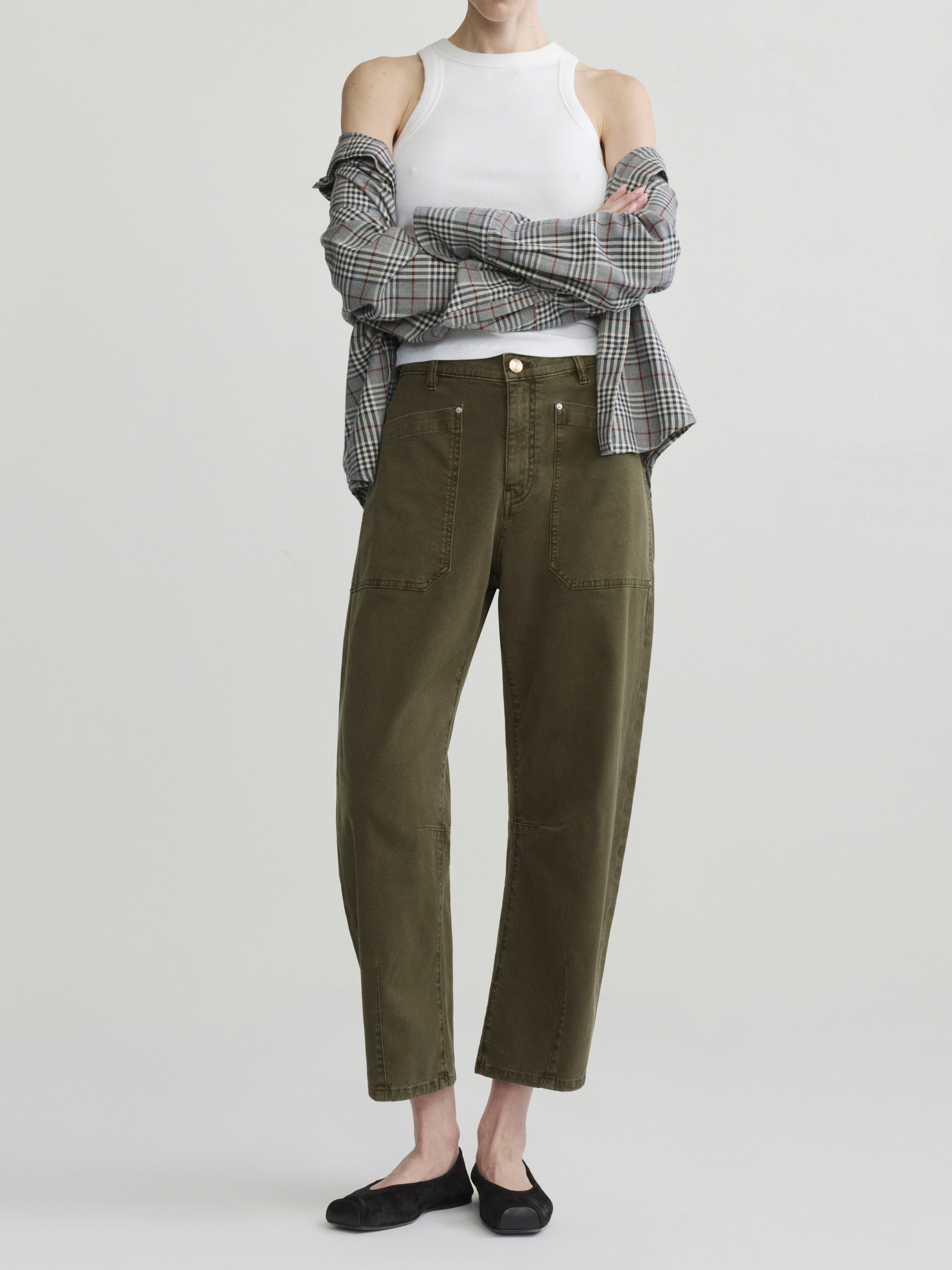 Bilie Easy Barrel jeans in Pine on a model with white tank and plaid shirt, full-length front view.