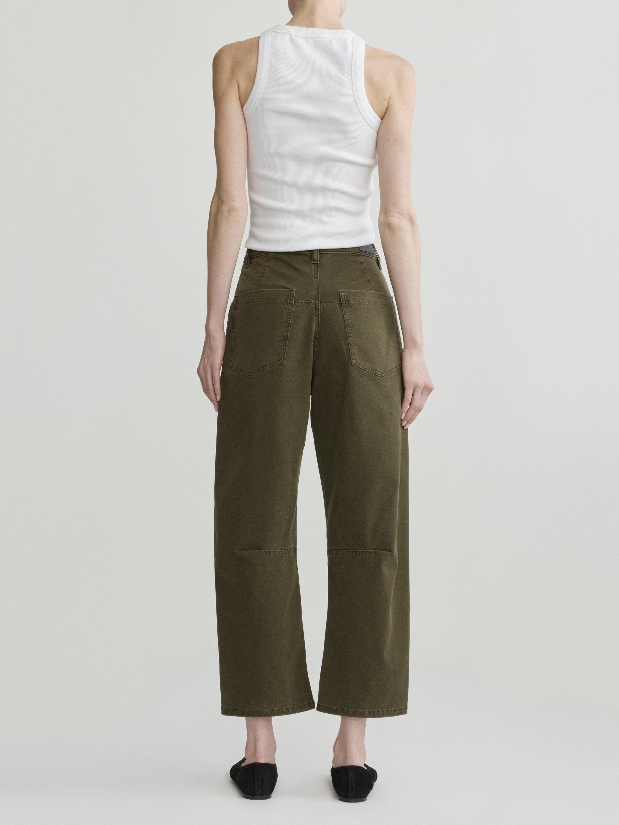 Bilie Easy Barrel jeans in Pine on a model with white tank top, full-length back view in studio.