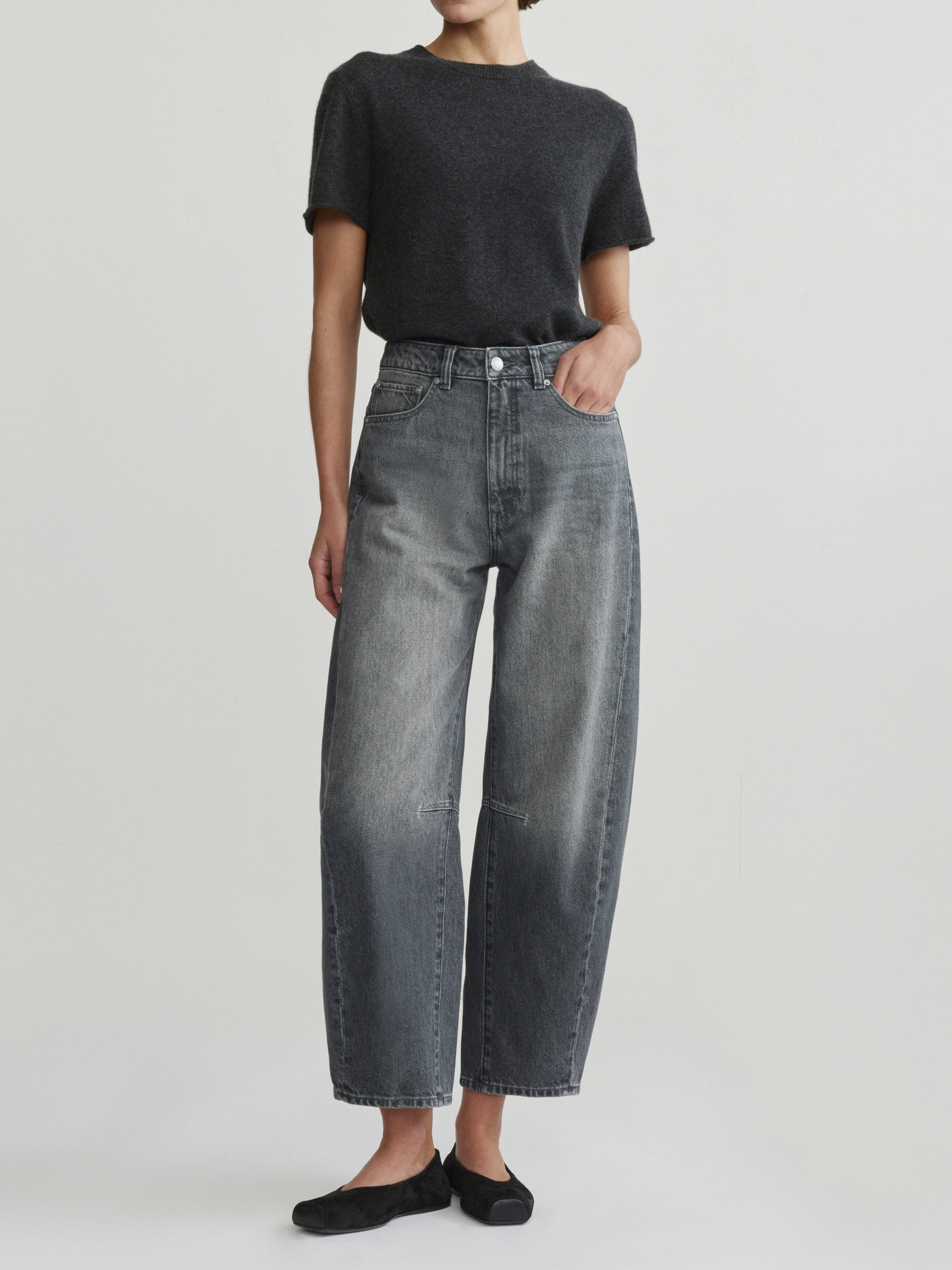 Miro Barrel jeans in Ash Grey on a model with charcoal tee, full-length front view in studio.