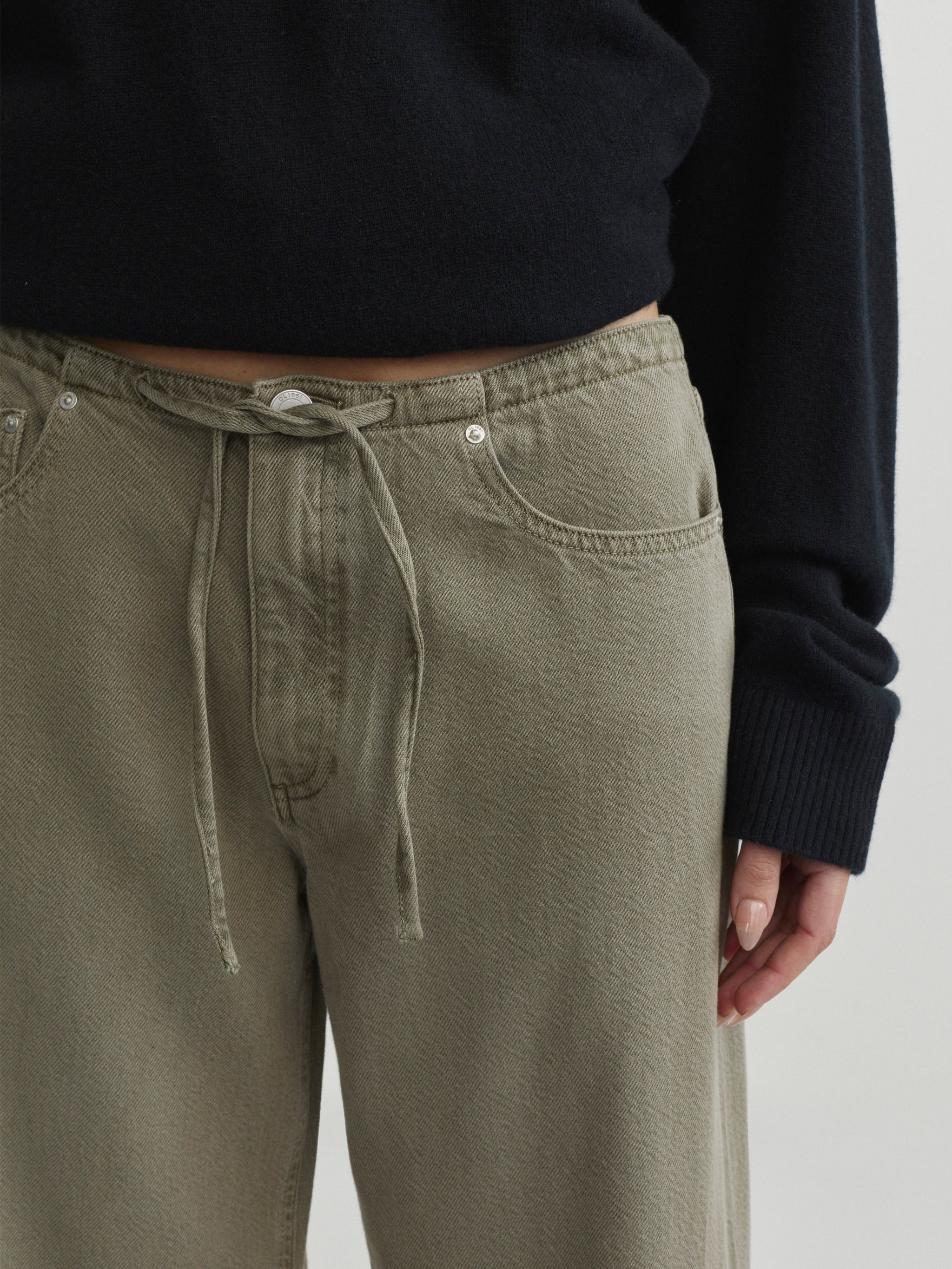 Sienna Low-Slung Wide Leg jeans in Clover Aura, close-up of drawstring waist and front pocket.
