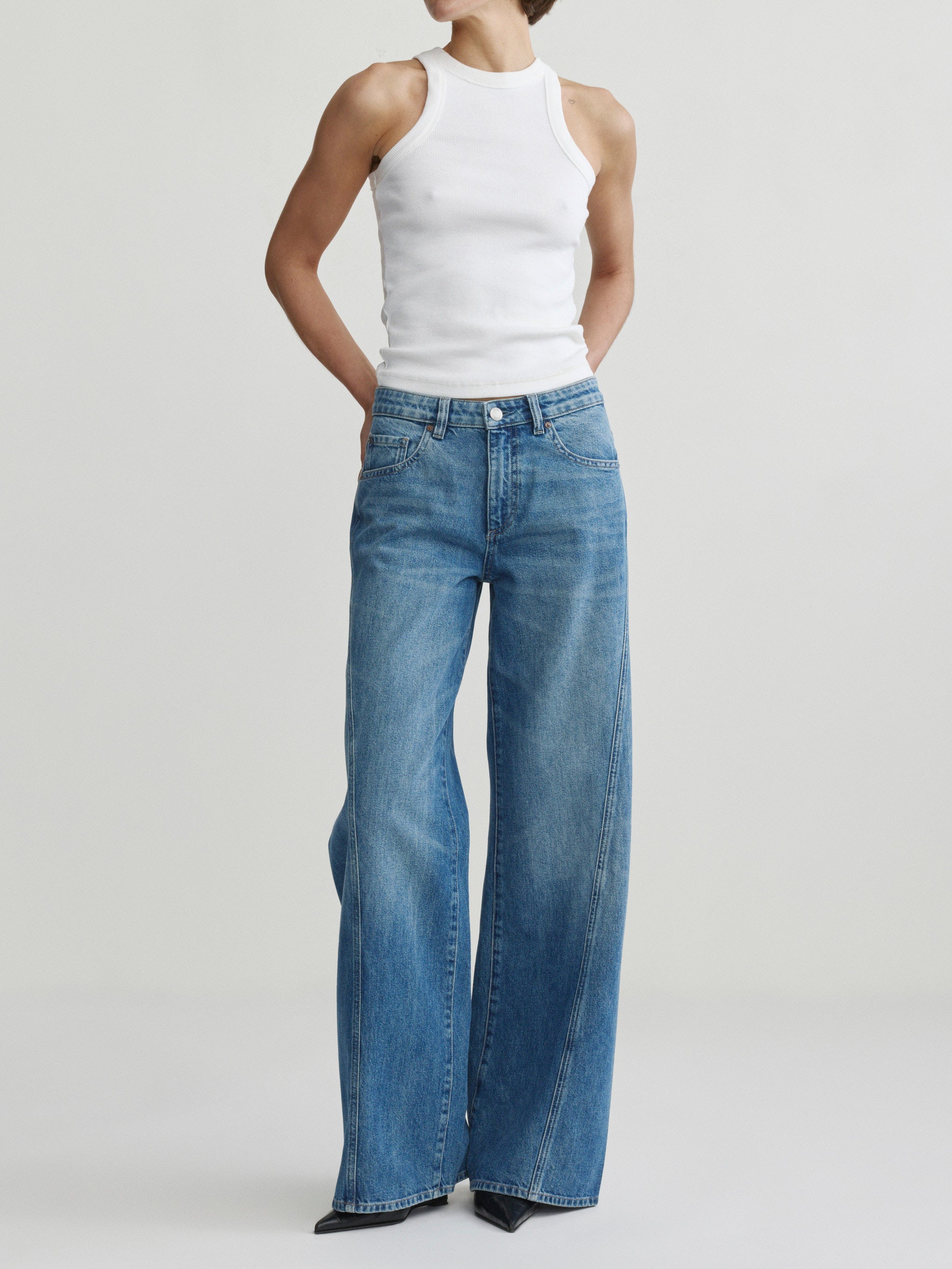 Alex Baggy Wide Leg jeans in Authentic on a model in white tank top, full-length front view.