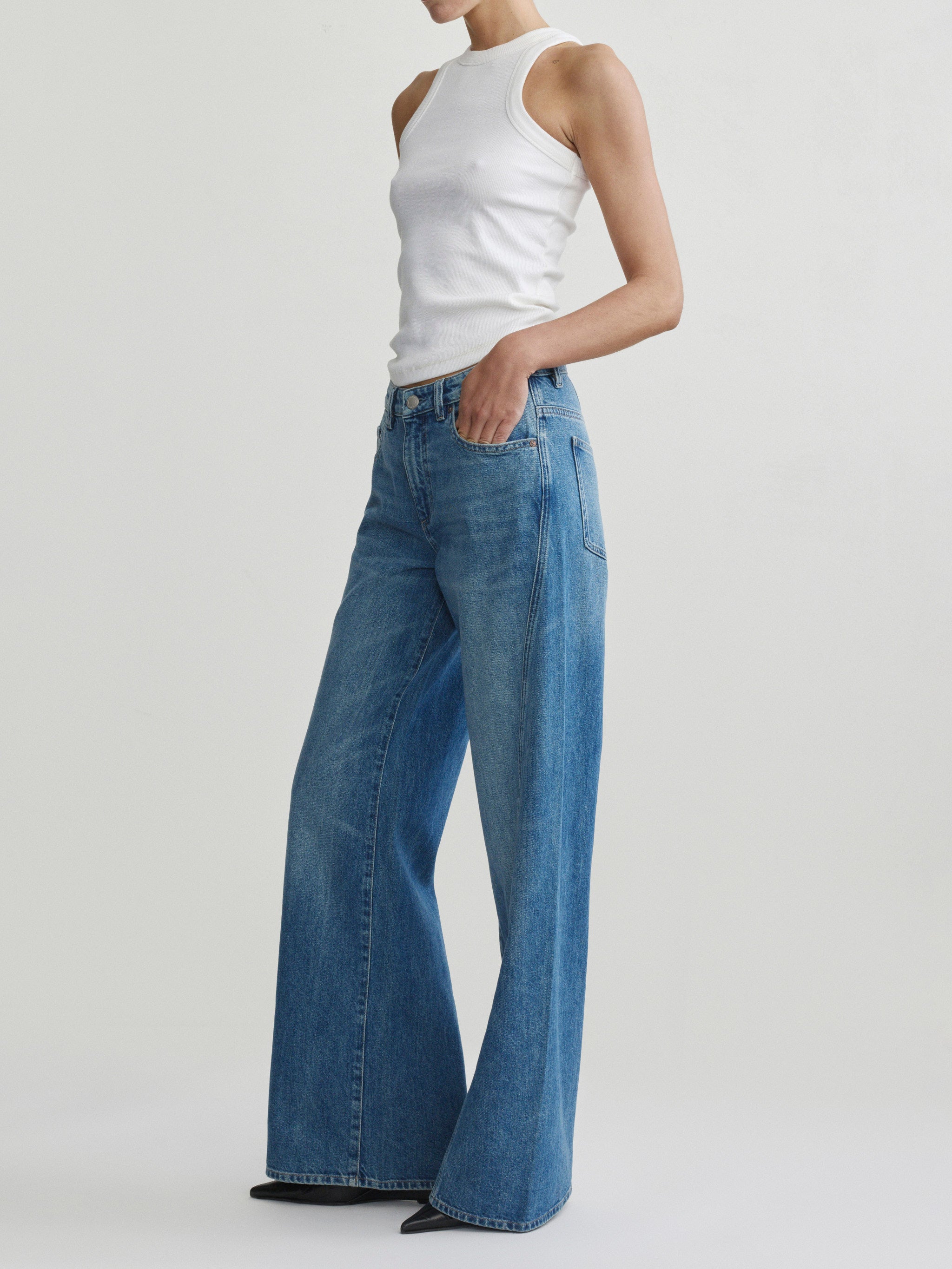 Alex Baggy Wide Leg jeans in Authentic on a model in white tank top, full-length side view.