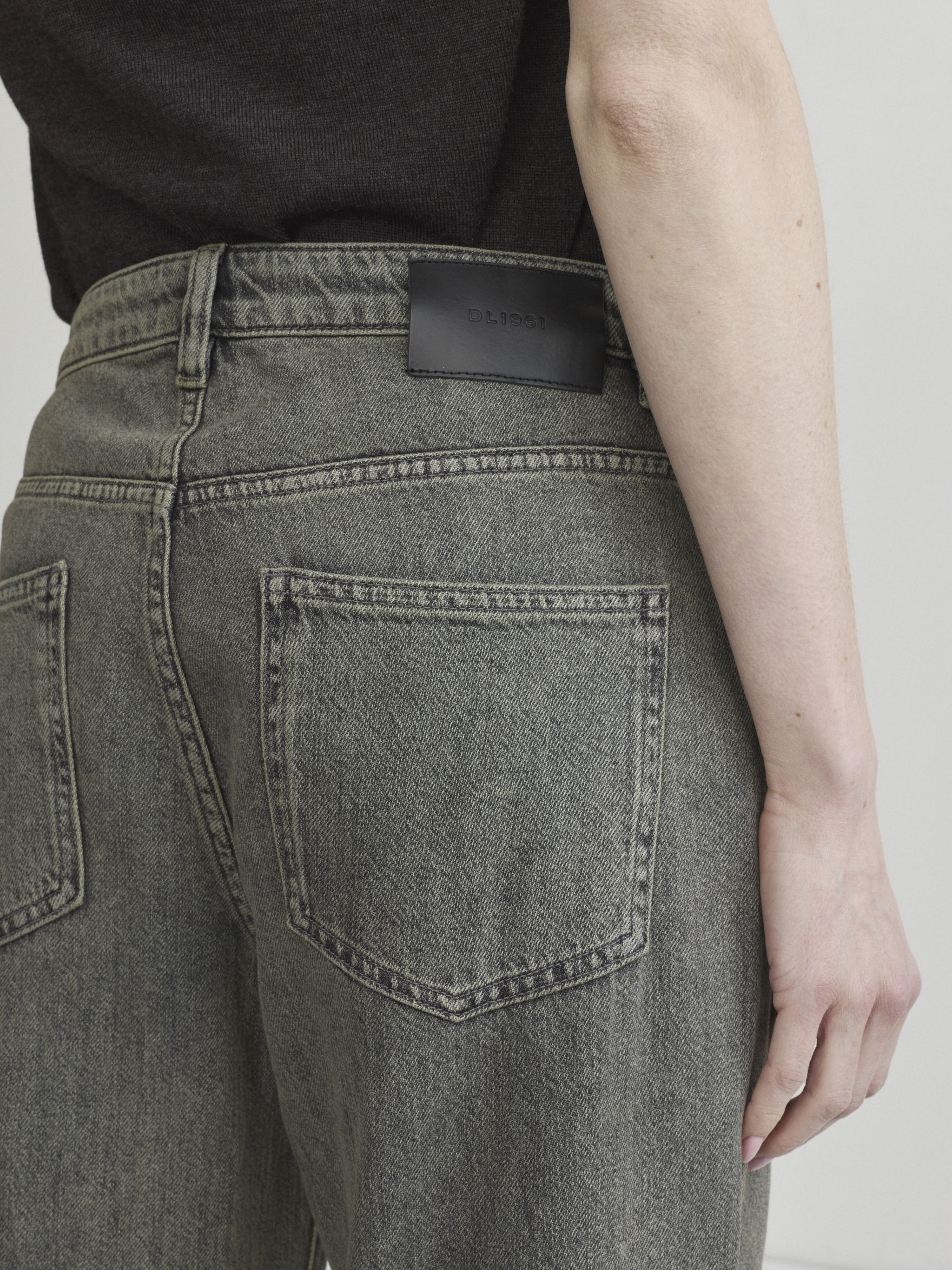 Alex Baggy Wide Leg jeans in Character Green Aura, close-up of back pocket and logo patch.