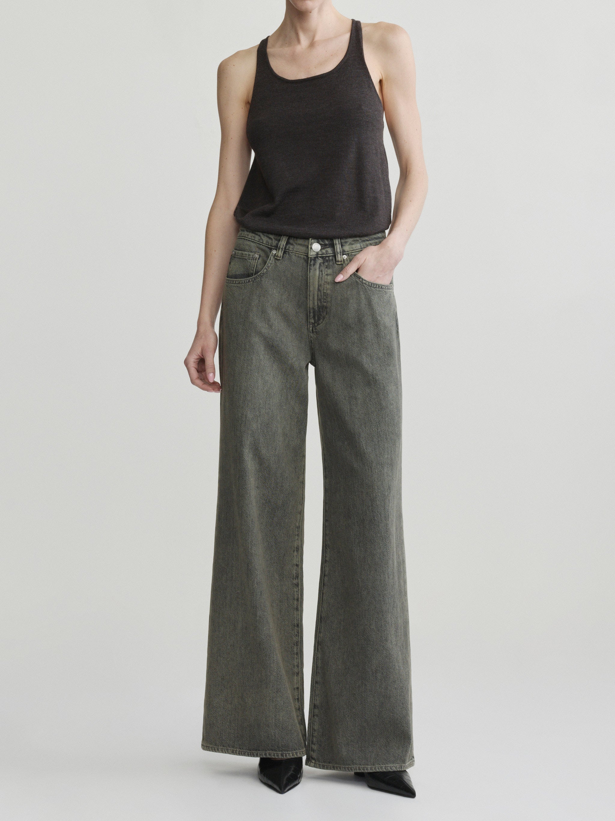 Alex Baggy Wide Leg jeans in Character Green Aura on a model in black tank top, full-length front view.