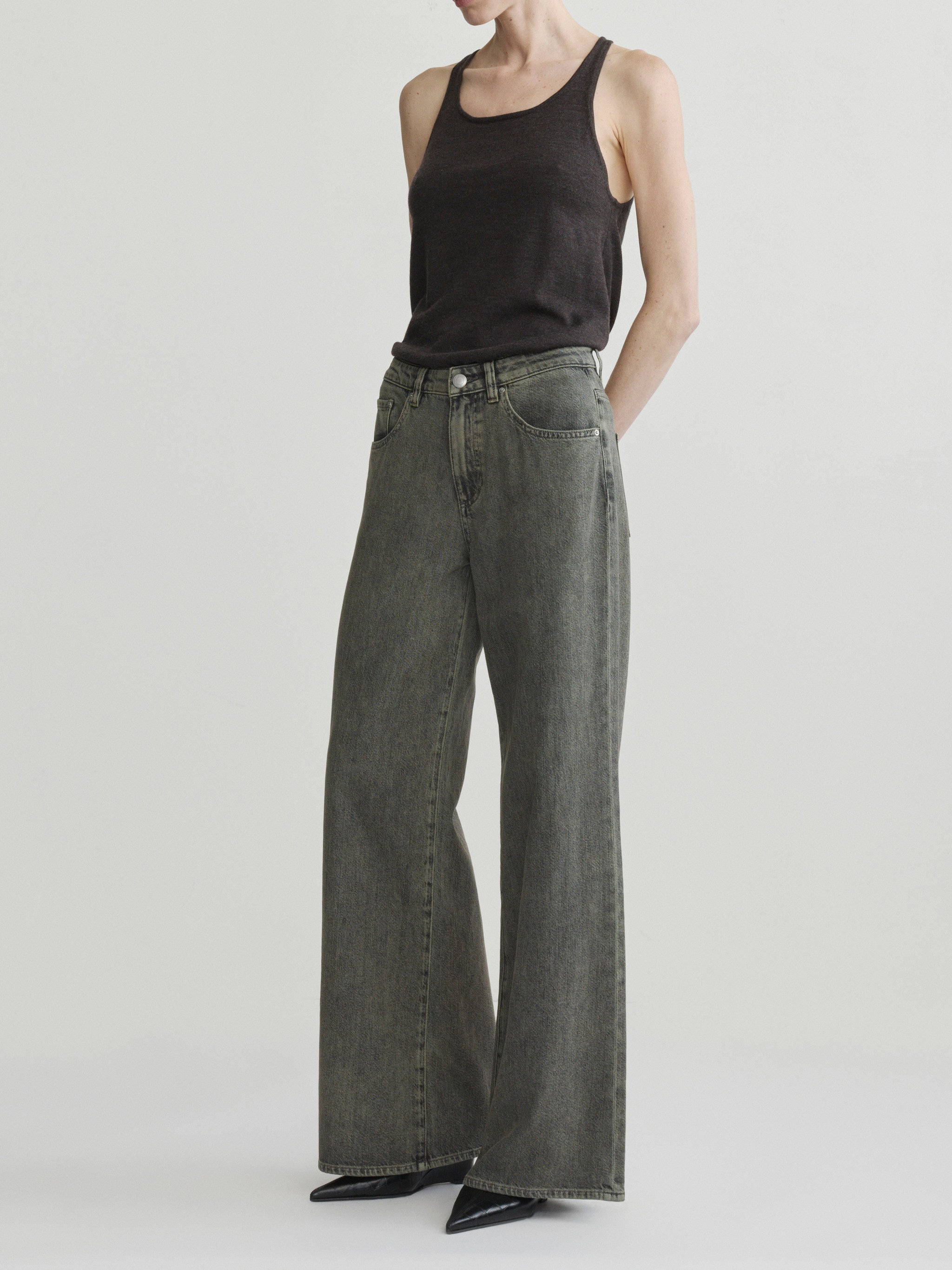 Alex Baggy Wide Leg jeans in Character Green Aura on a model in black tank top, full-length front view.