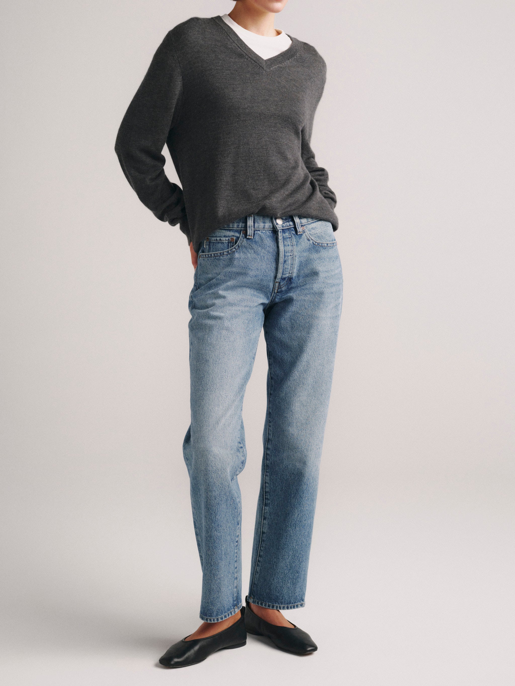 DL1961 x Olympia Slim Straight Jeans in Greece — front view, hand in pocket