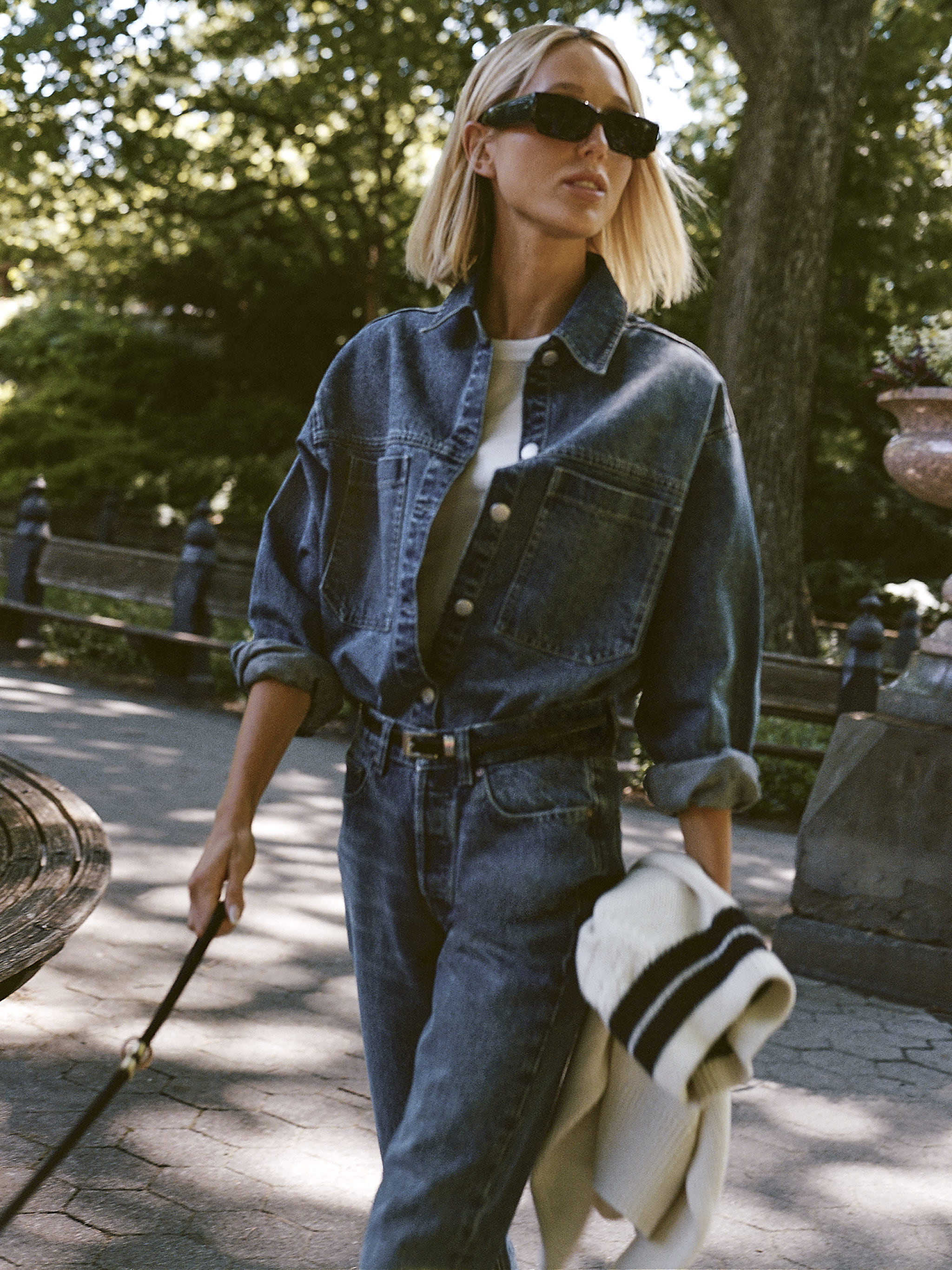 DL1961 x Olympia Addison Overshirt in Royal — worn open over a white tee with the matching Slim Straight Jeans, walking in Central Park
