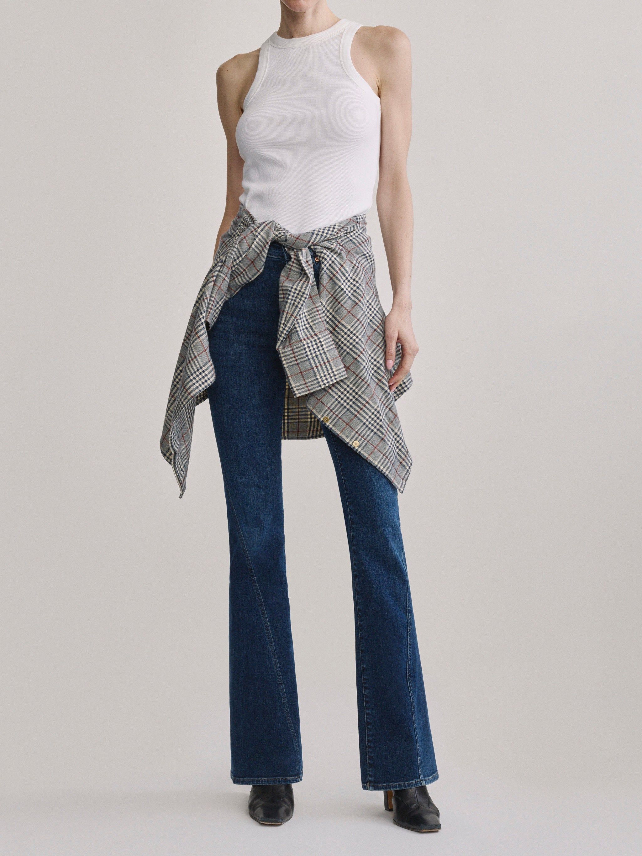 Bridget Boot Breeze Seamed jeans with High Neck Ribbed Tank in White, plaid shirt tied at waist, front view.
