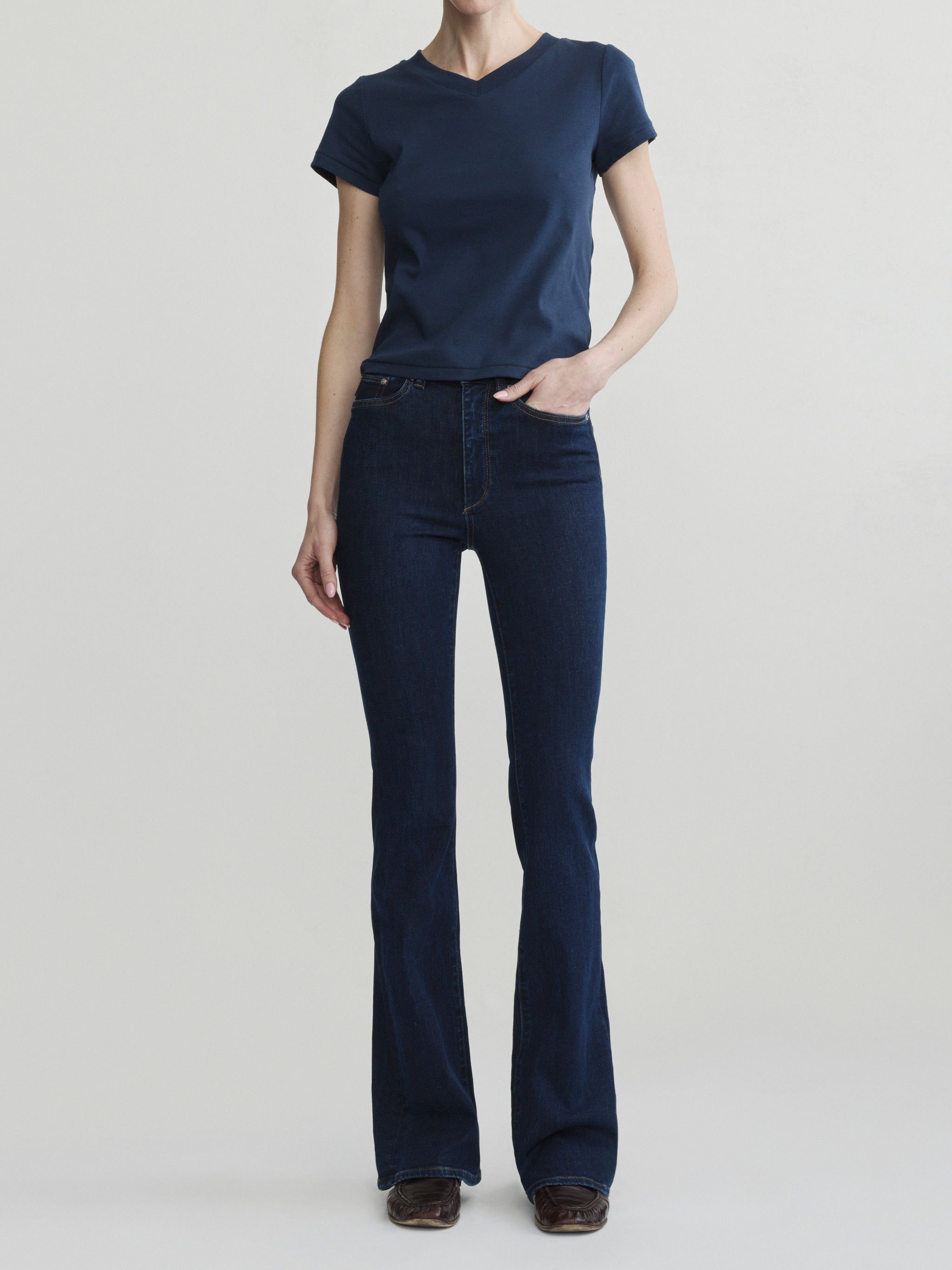 Bridget Boot jeans in Night Out with Shrunken V-Neck Tee in Navy, full-length front view on a model.