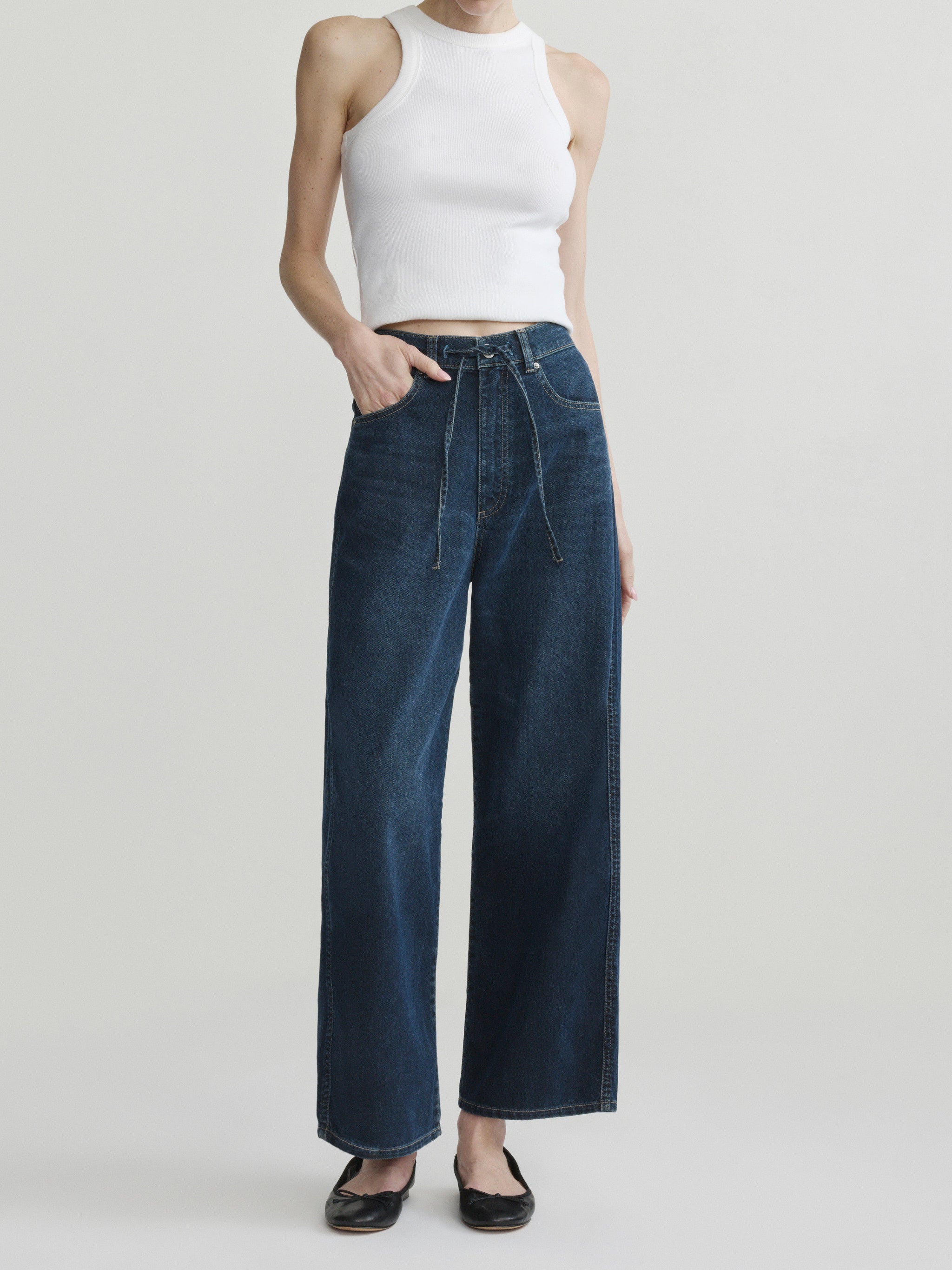 Taylor Relaxed Barrel jeans in Jazz Aura on a model in white tank top, full-length front view.