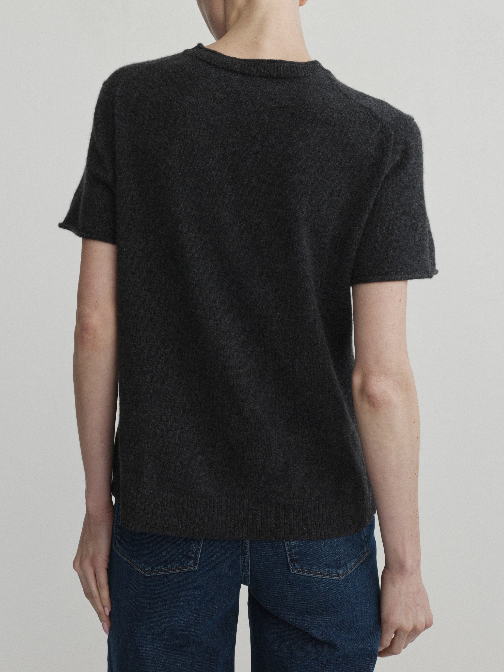 Hepburn Wide Leg jeans in Eve with Charcoal Knit Tee, model back view, upper-body crop.